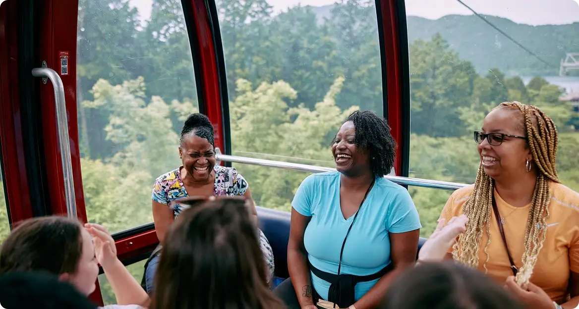 Women on a gondola laughing