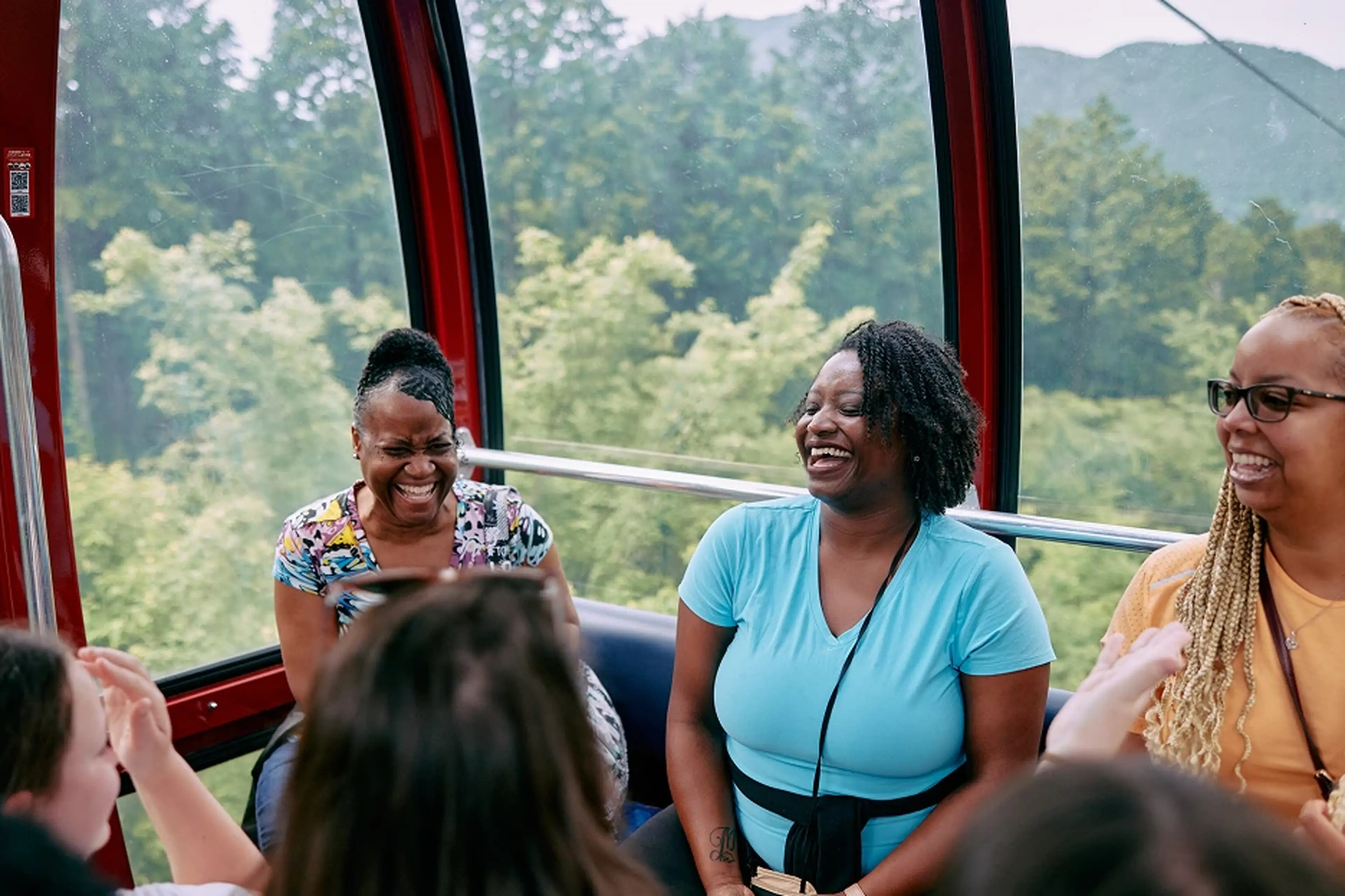 Women on a gondola laughing