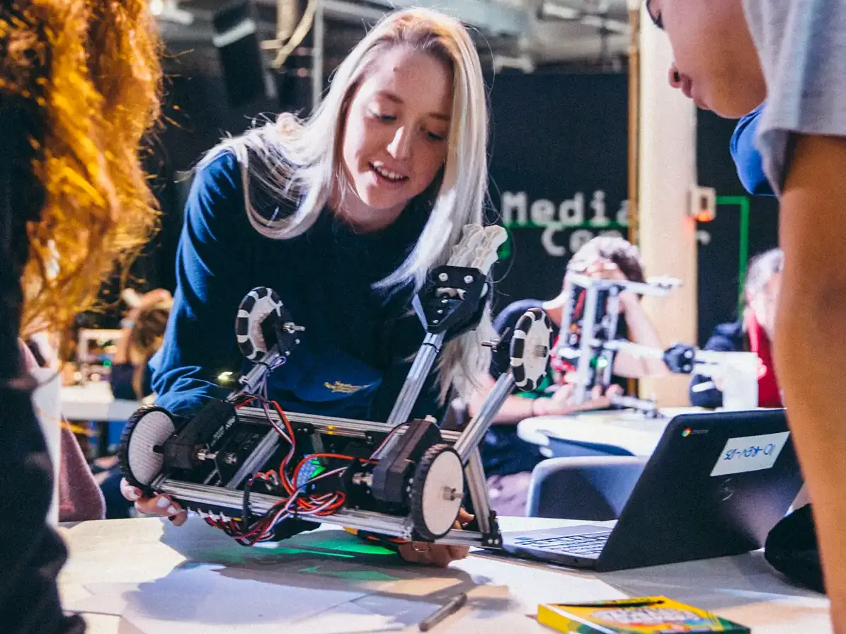 Travelers participating in robotics workshop on tour