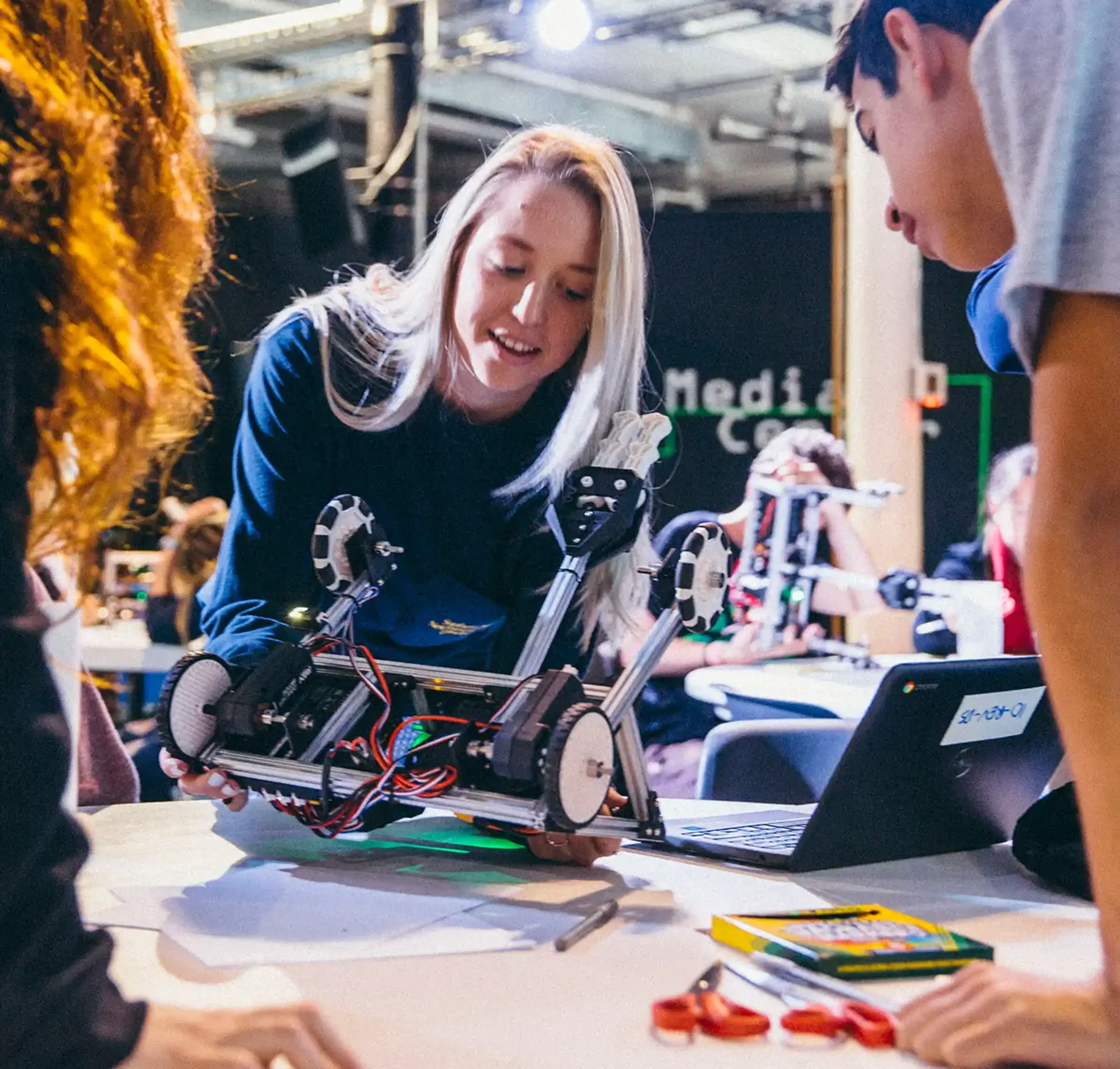 Travelers participating in robotics workshop on tour