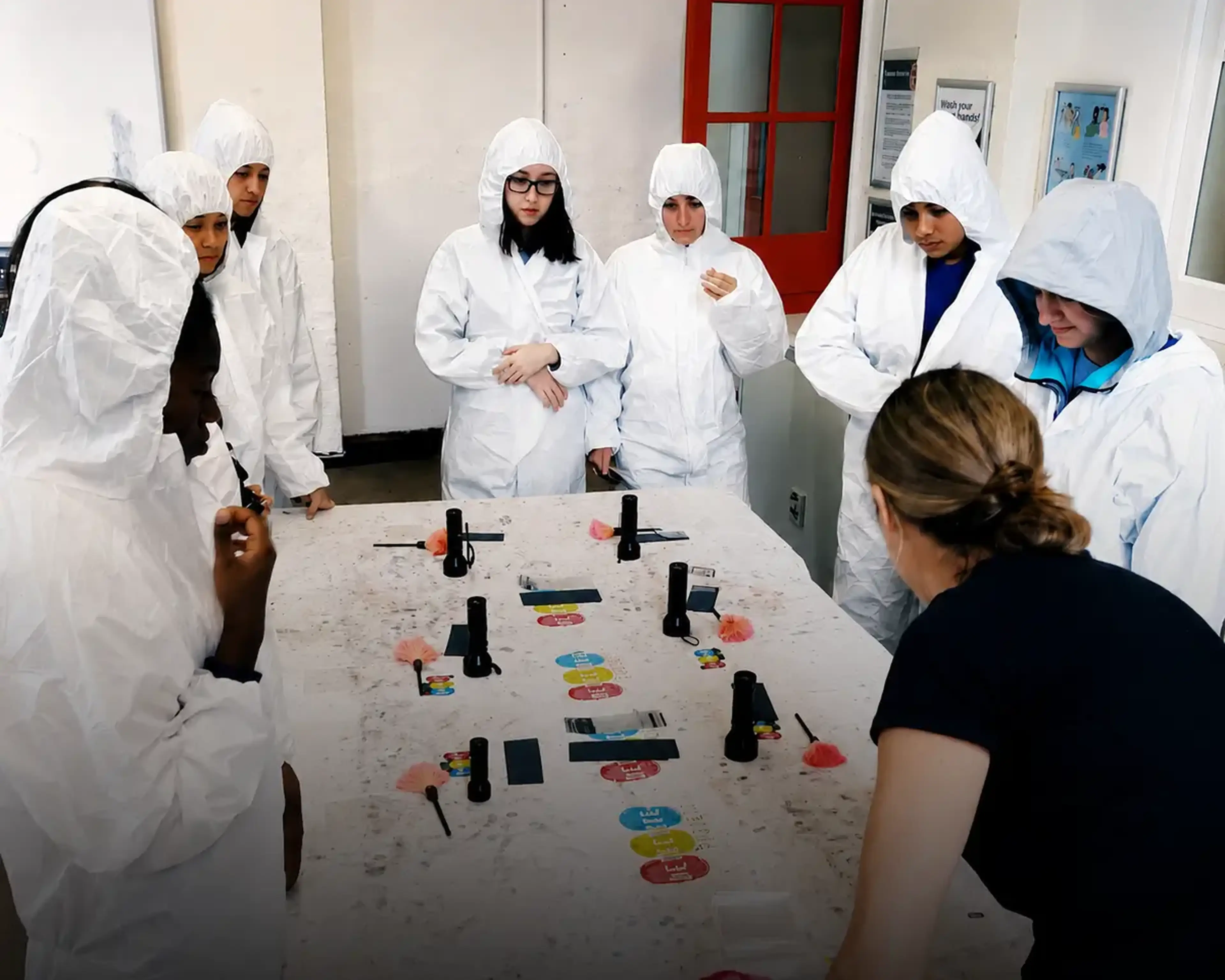 Students participating in a forensic workshop in London