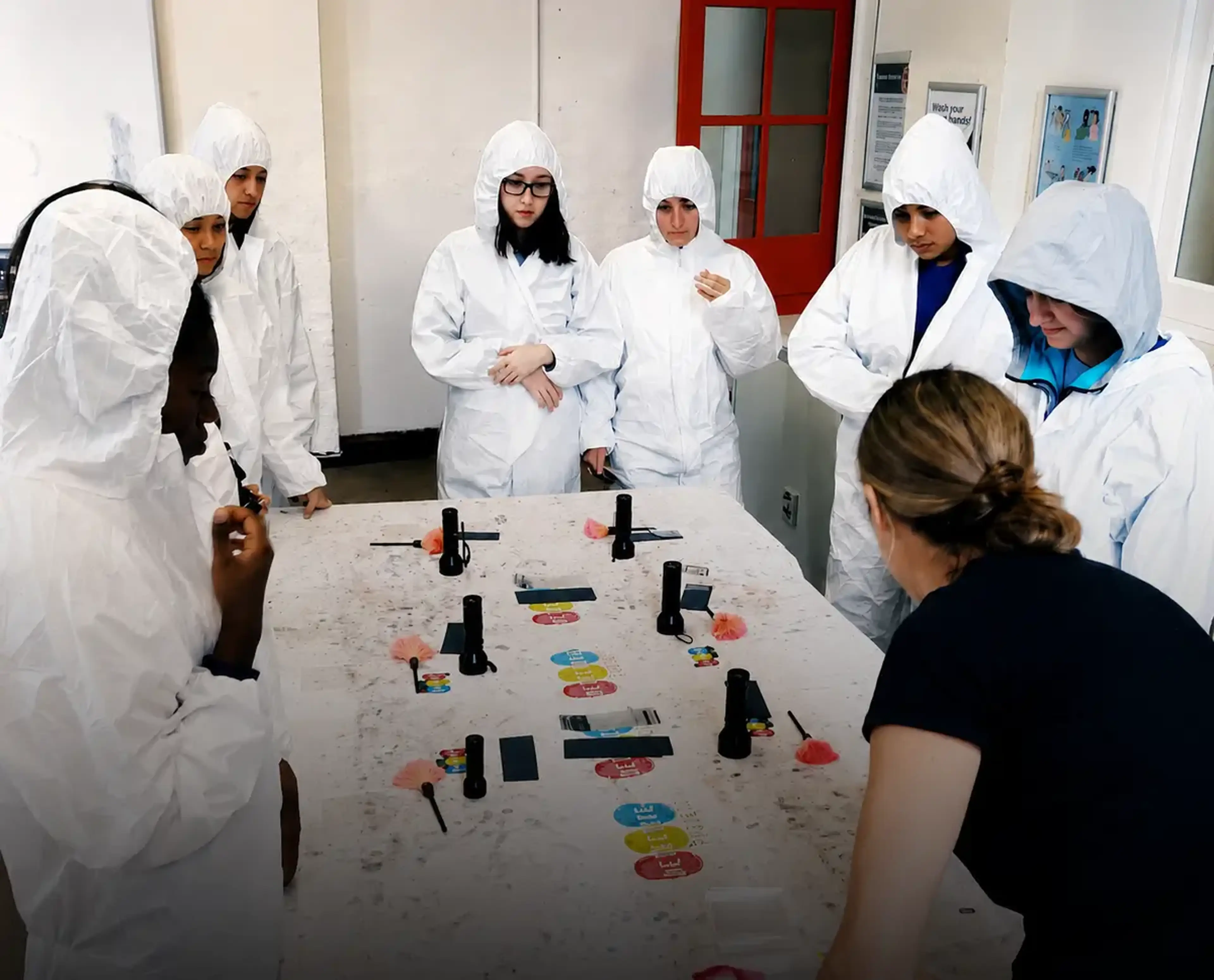Students participating in a forensic workshop in London