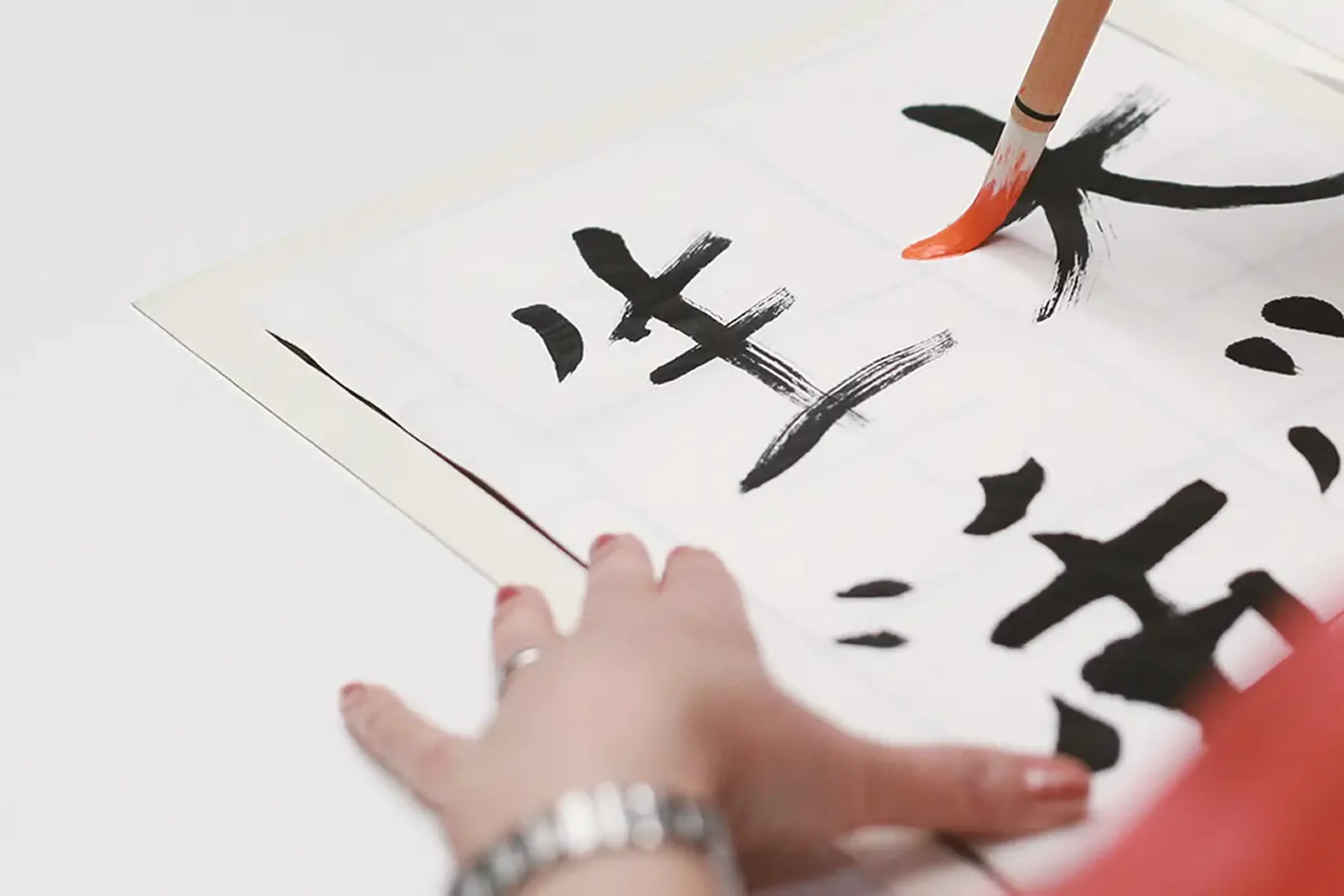 student painting calligraphy