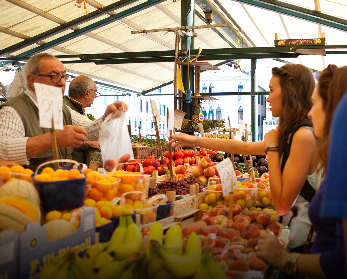 Students purchasing from vendor at Italian market