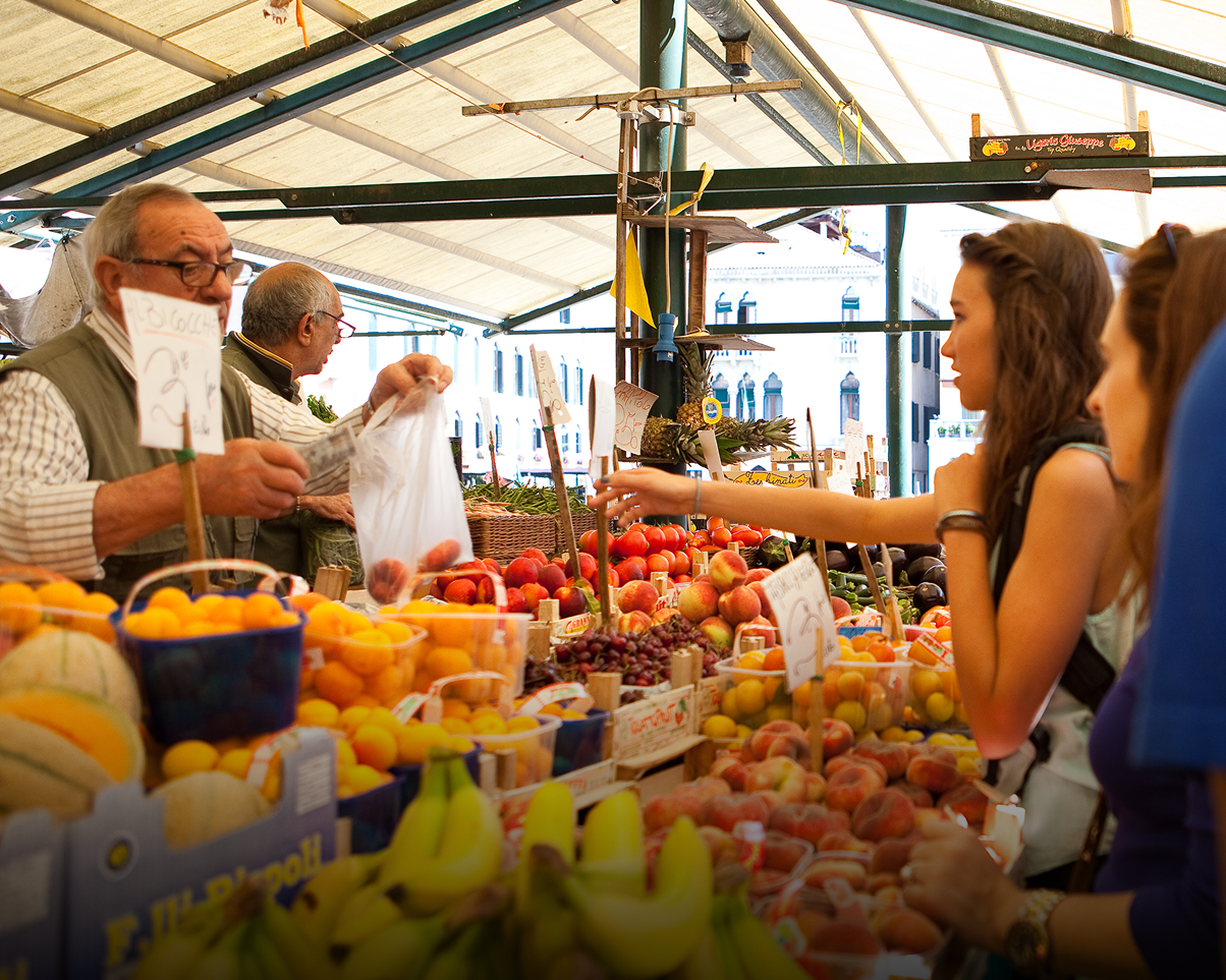 Students purchasing from vendor at Italian market