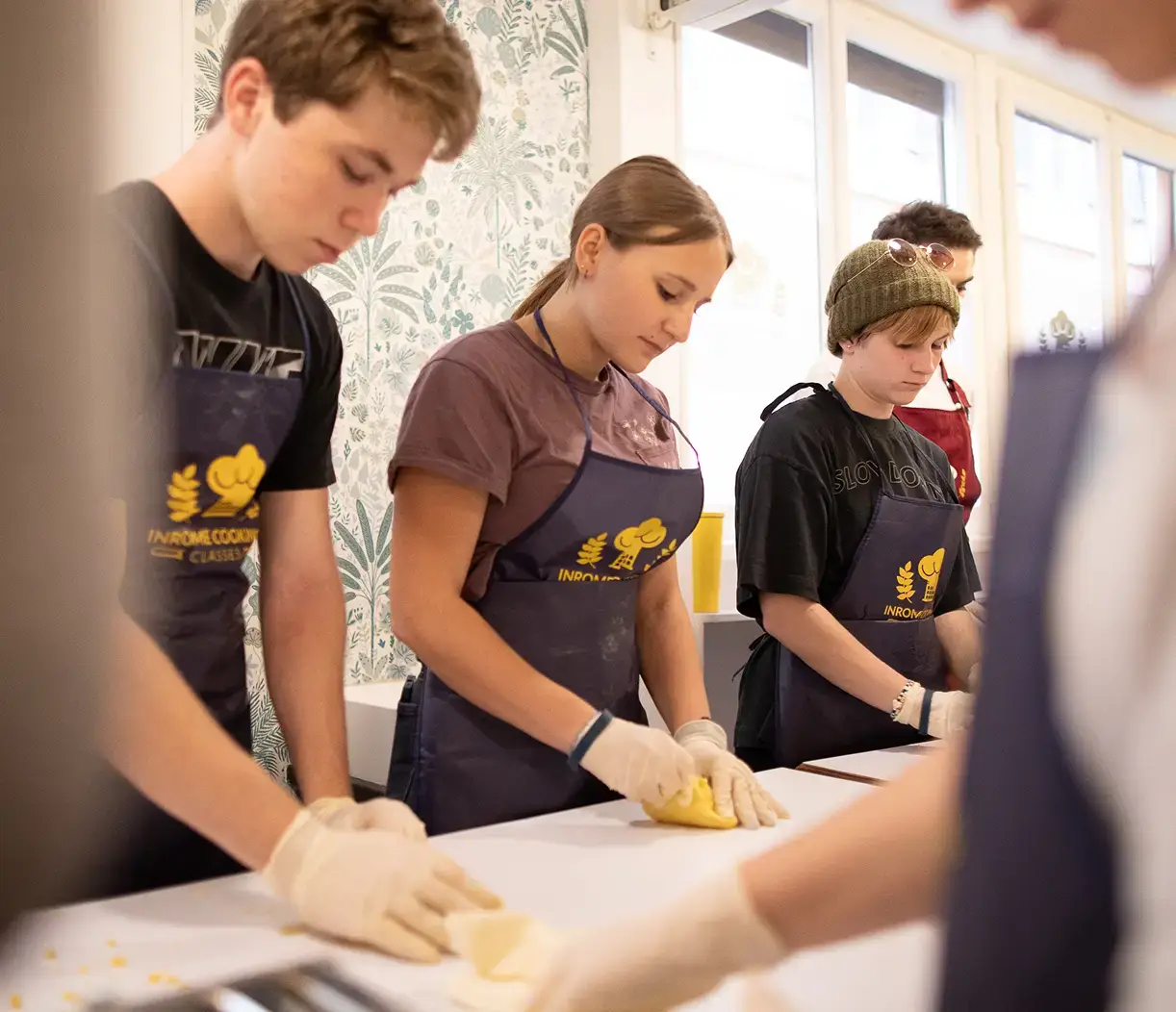 Students participating in pasta-making class in Italy