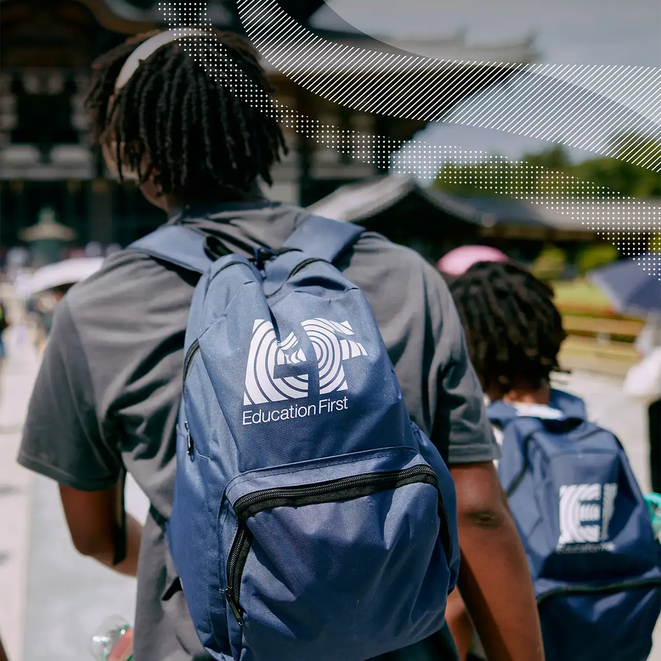 Travelers on tour wearing EF backpacks