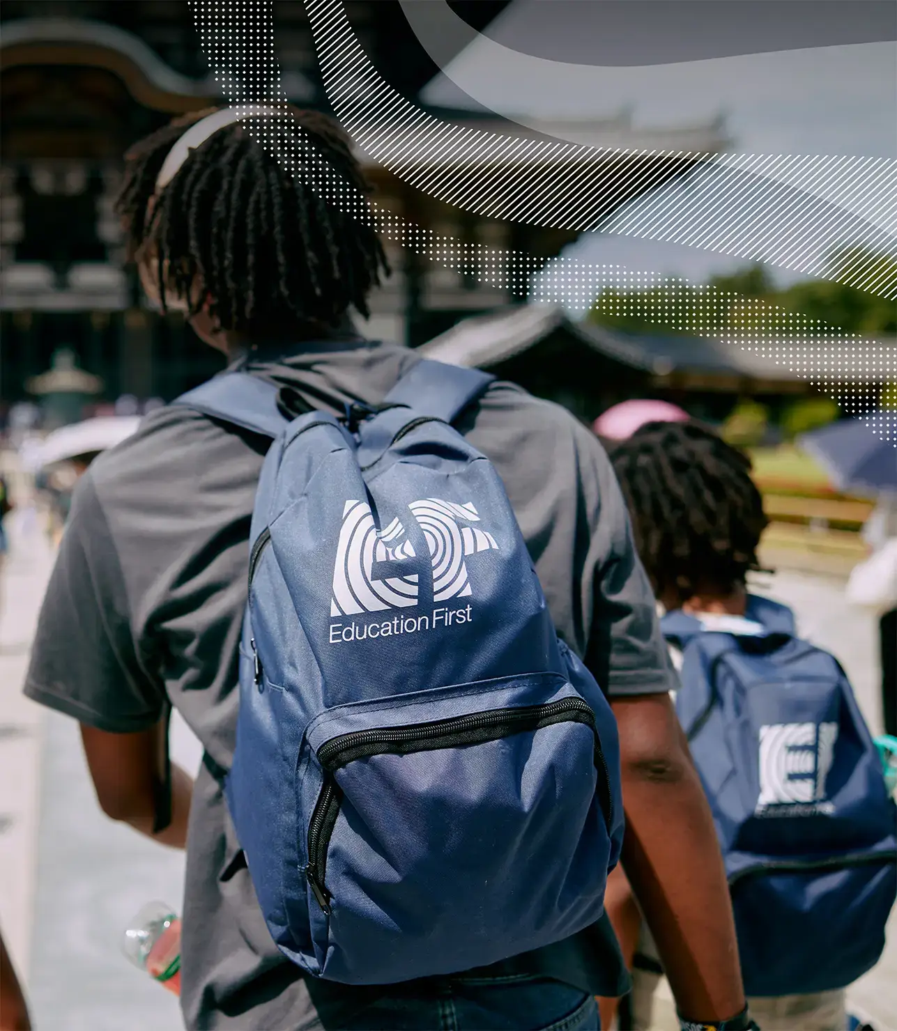 Travelers on tour wearing EF backpacks