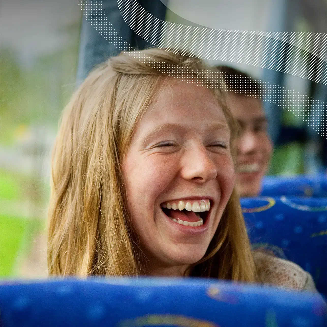 Traveler on tour laughing on the bus