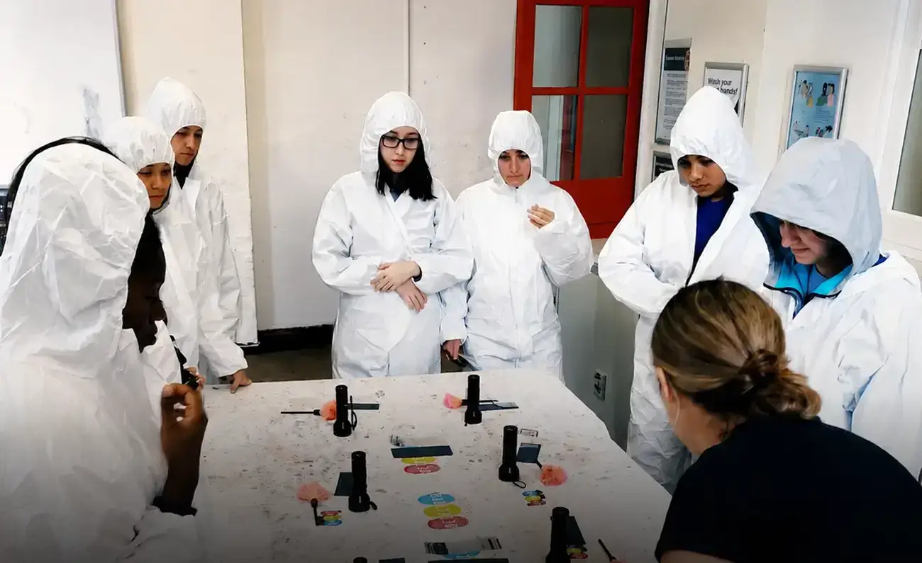 Students participating in a forensic workshop in London