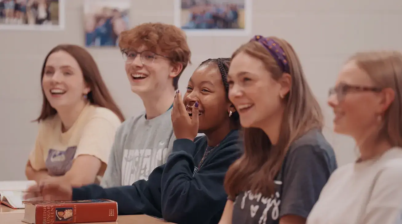 students laughing in a classroom