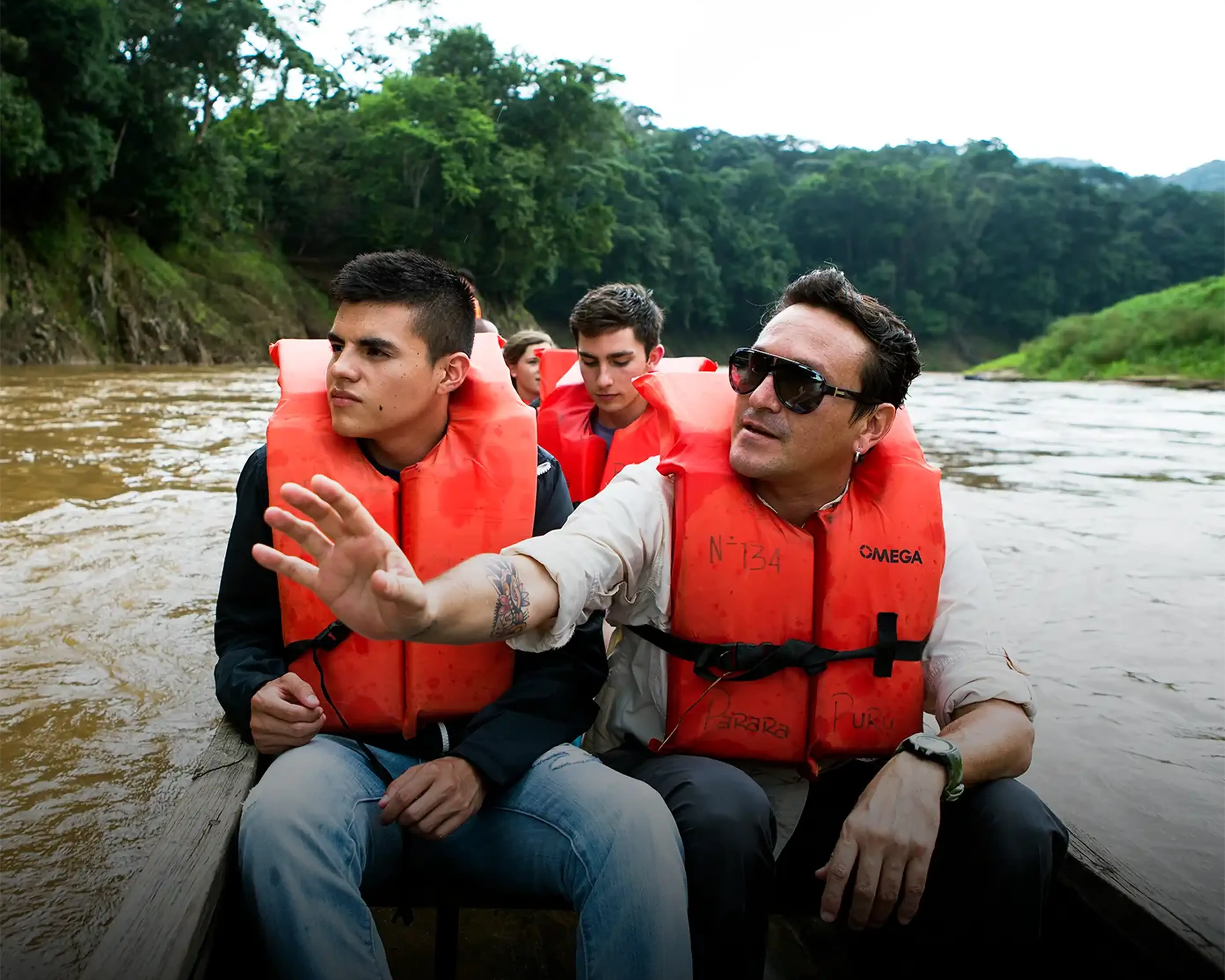 Travelers and guide on boat ride in Panama