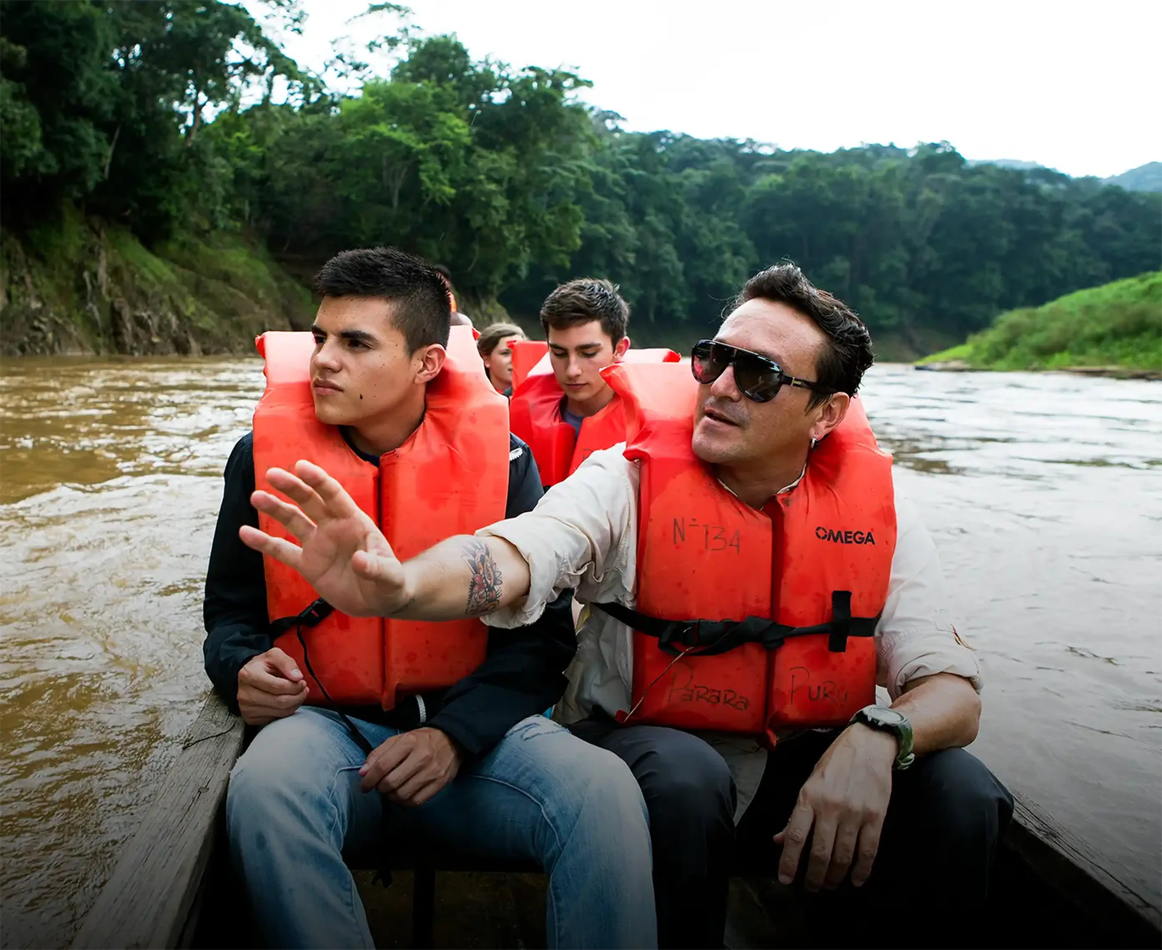 Travelers and guide on boat ride in Panama
