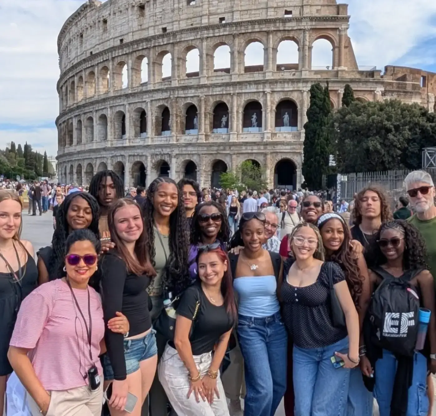 Group of travelers visiting the Colosseum in Rome