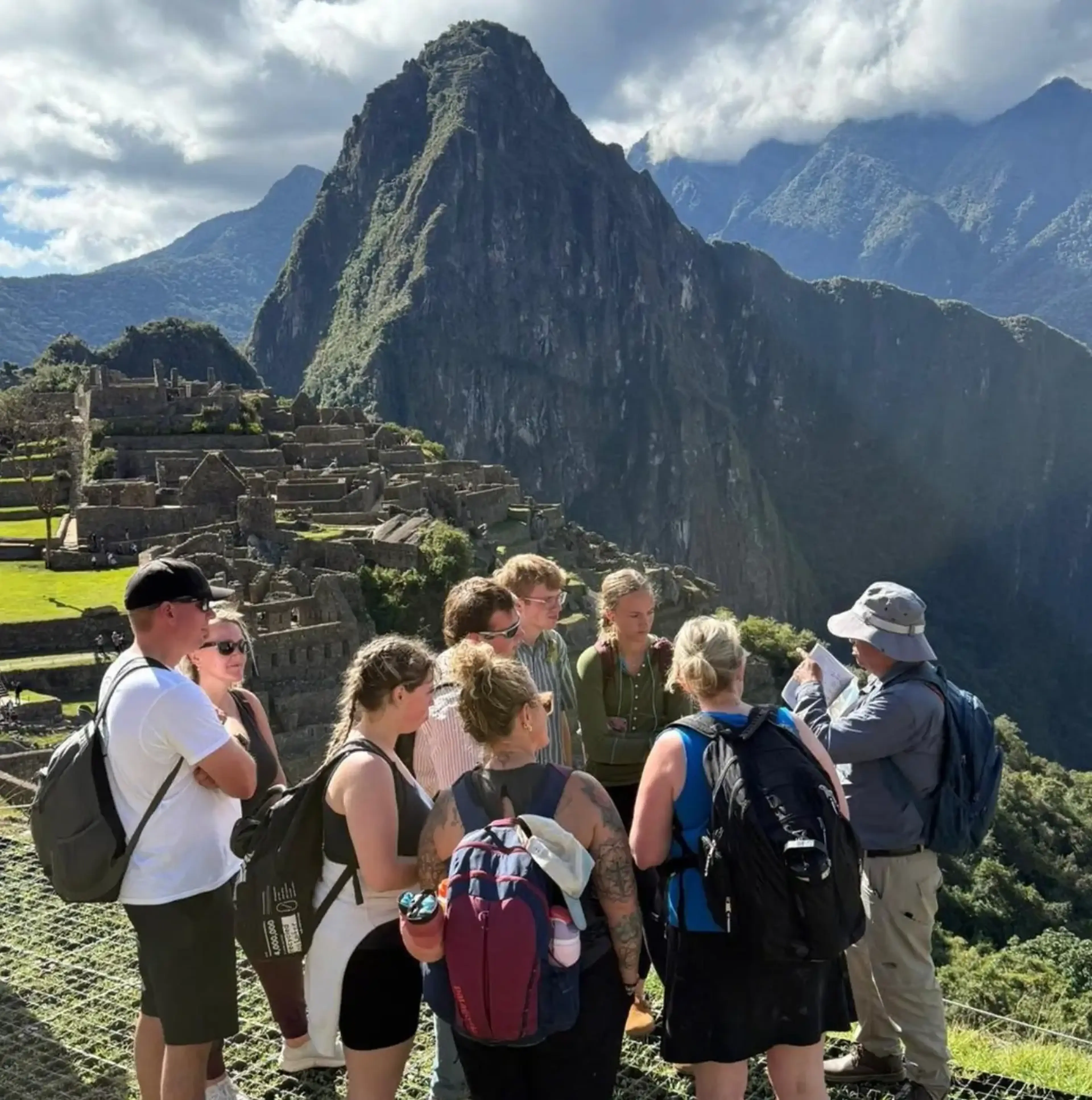 Group of travelers visiting Machu Picchu