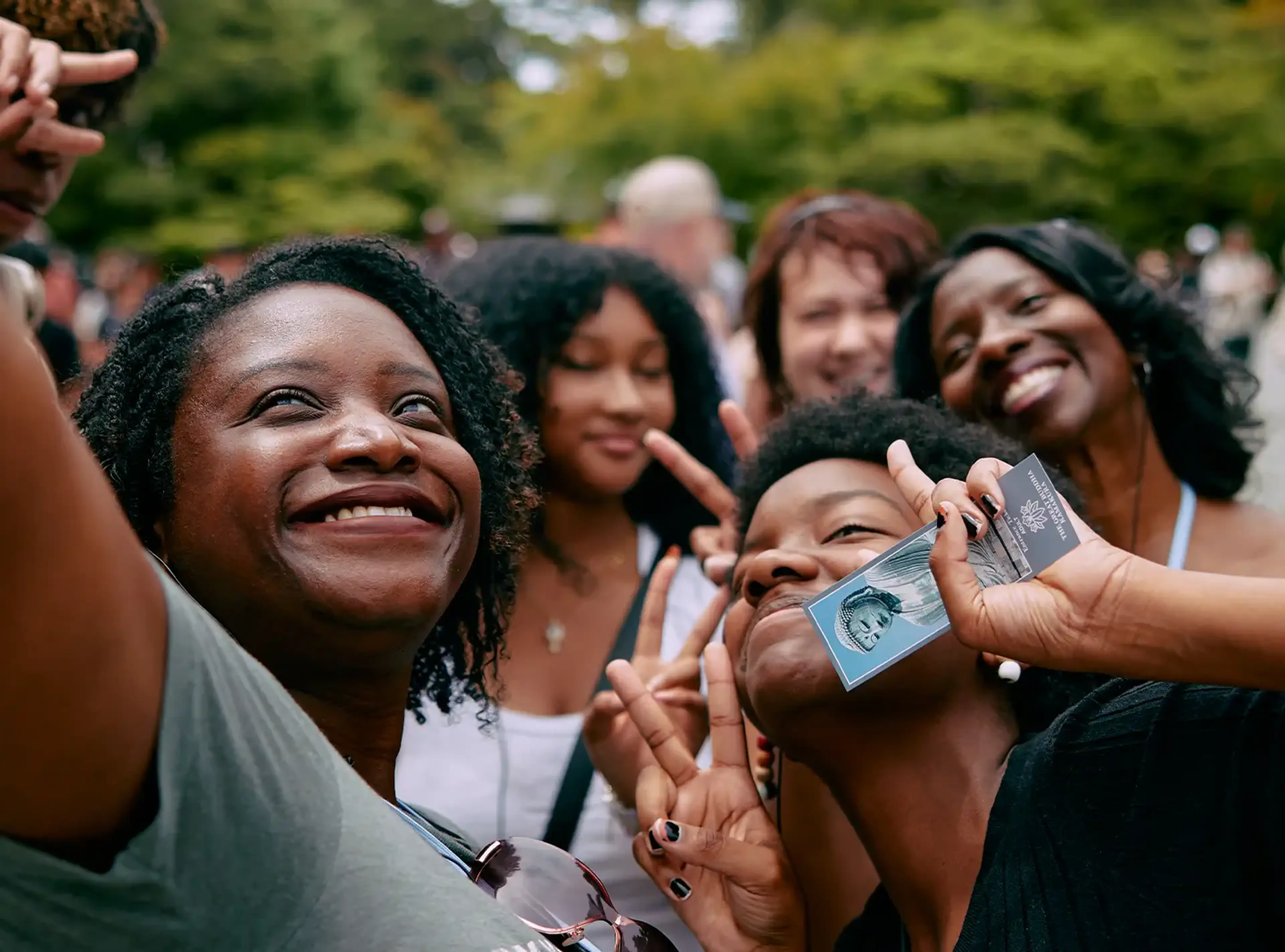 students taking a selfie with group leader on tour