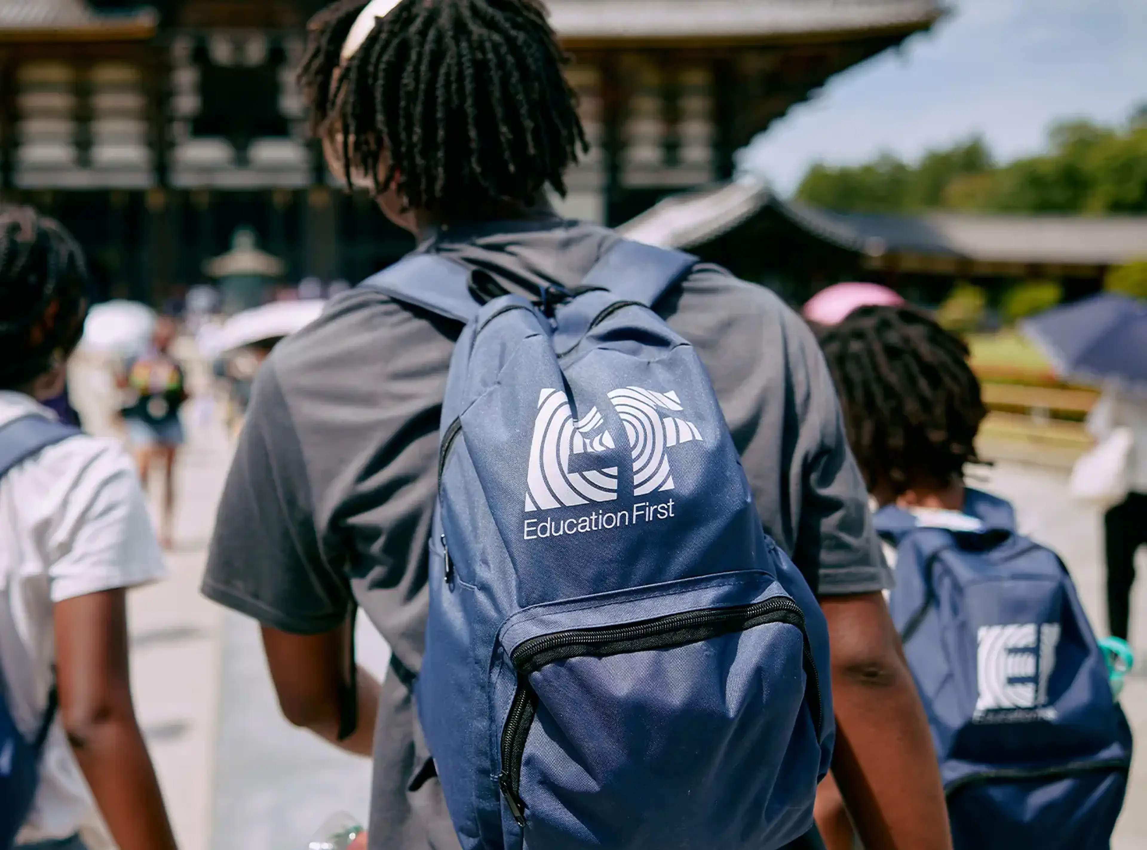 school trip packing list: student wearing EF backpack