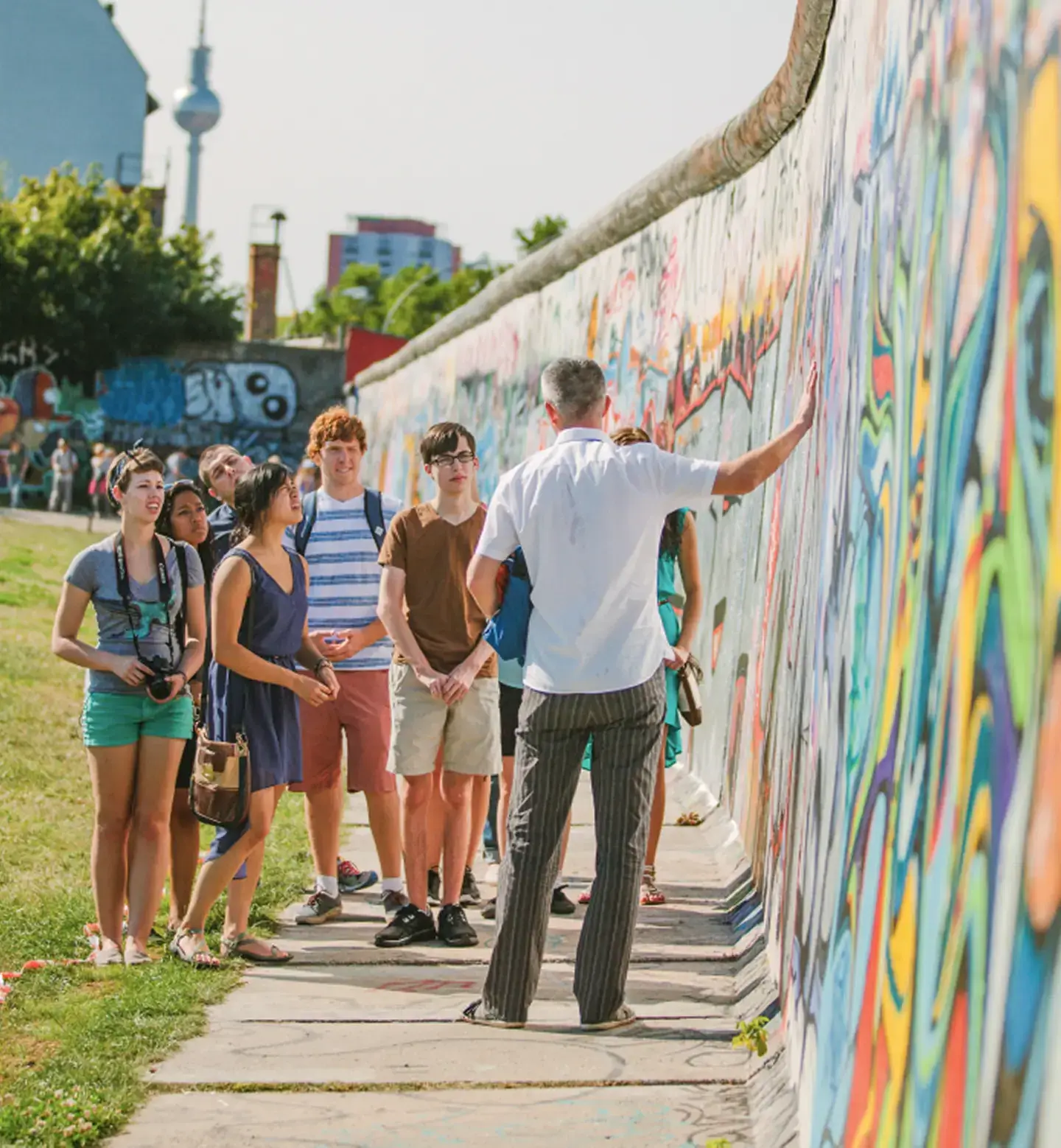 student group looking at street art