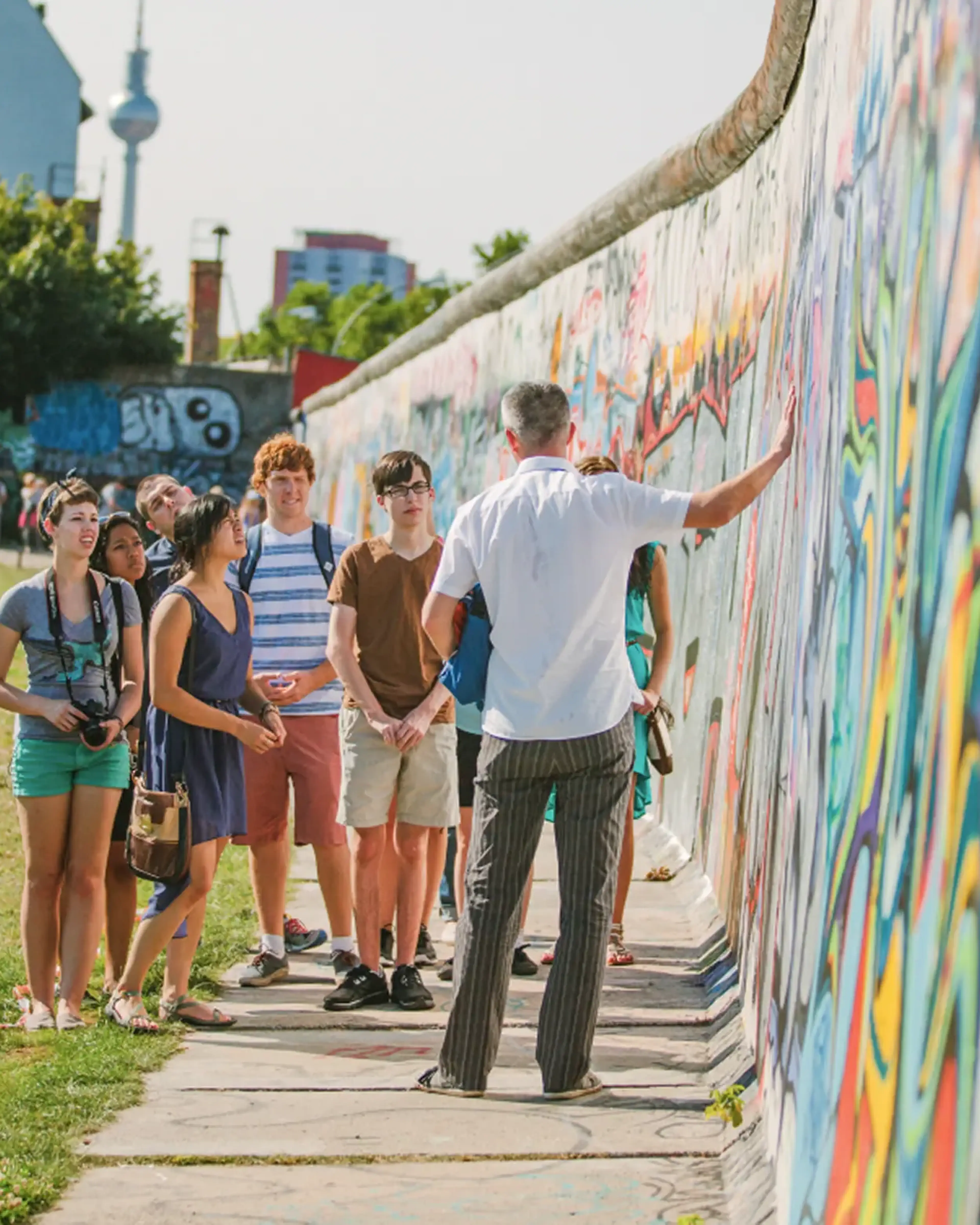 student group looking at street art