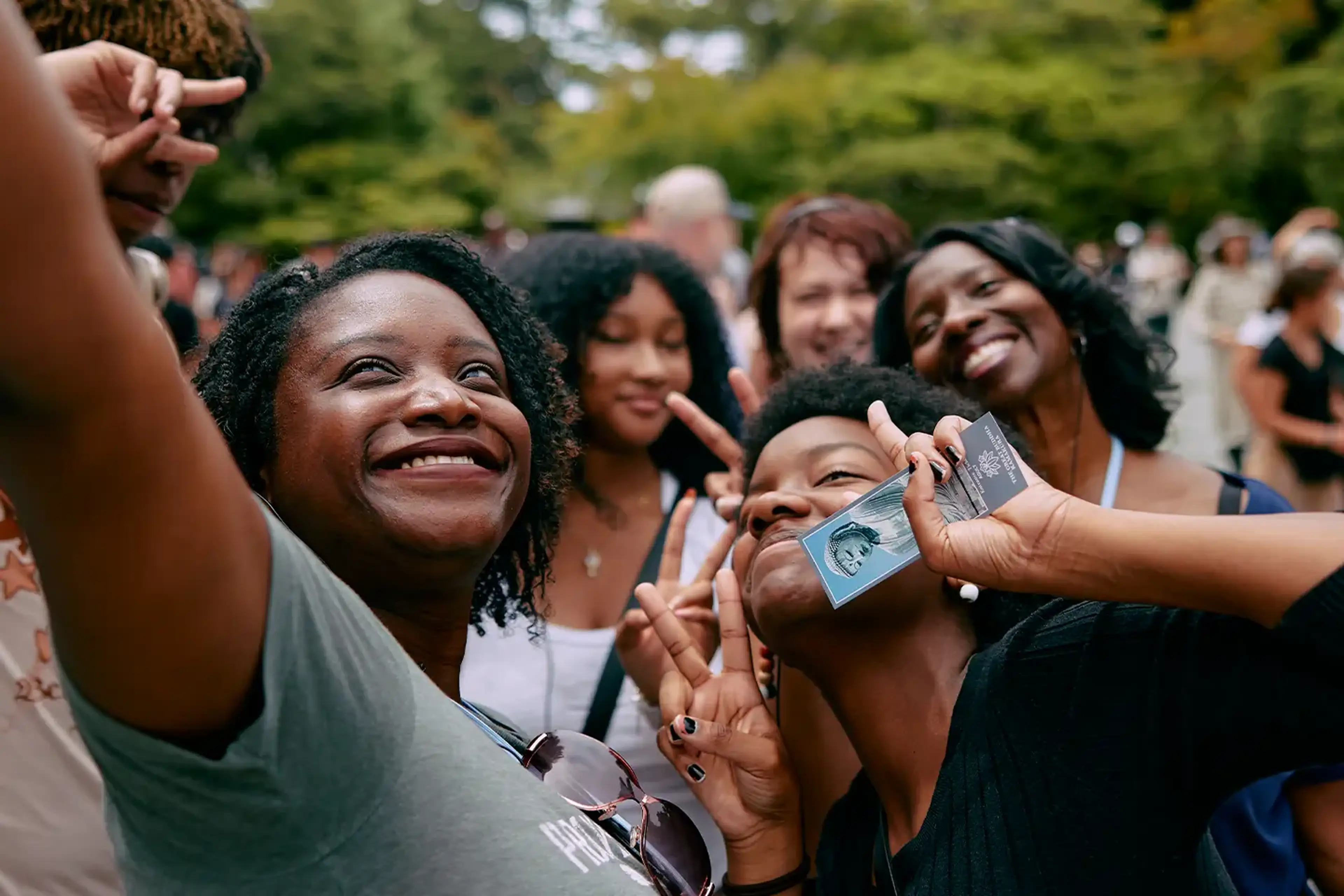 Students taking a selfie with group leader on tour