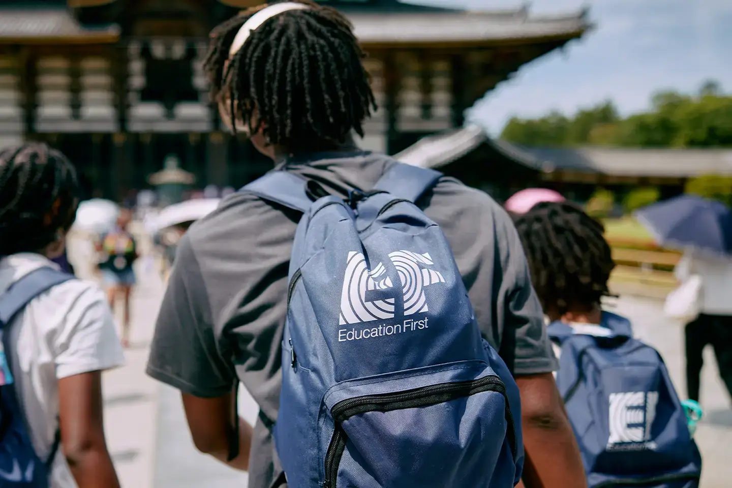 School trip packing list: student wearing EF backpack