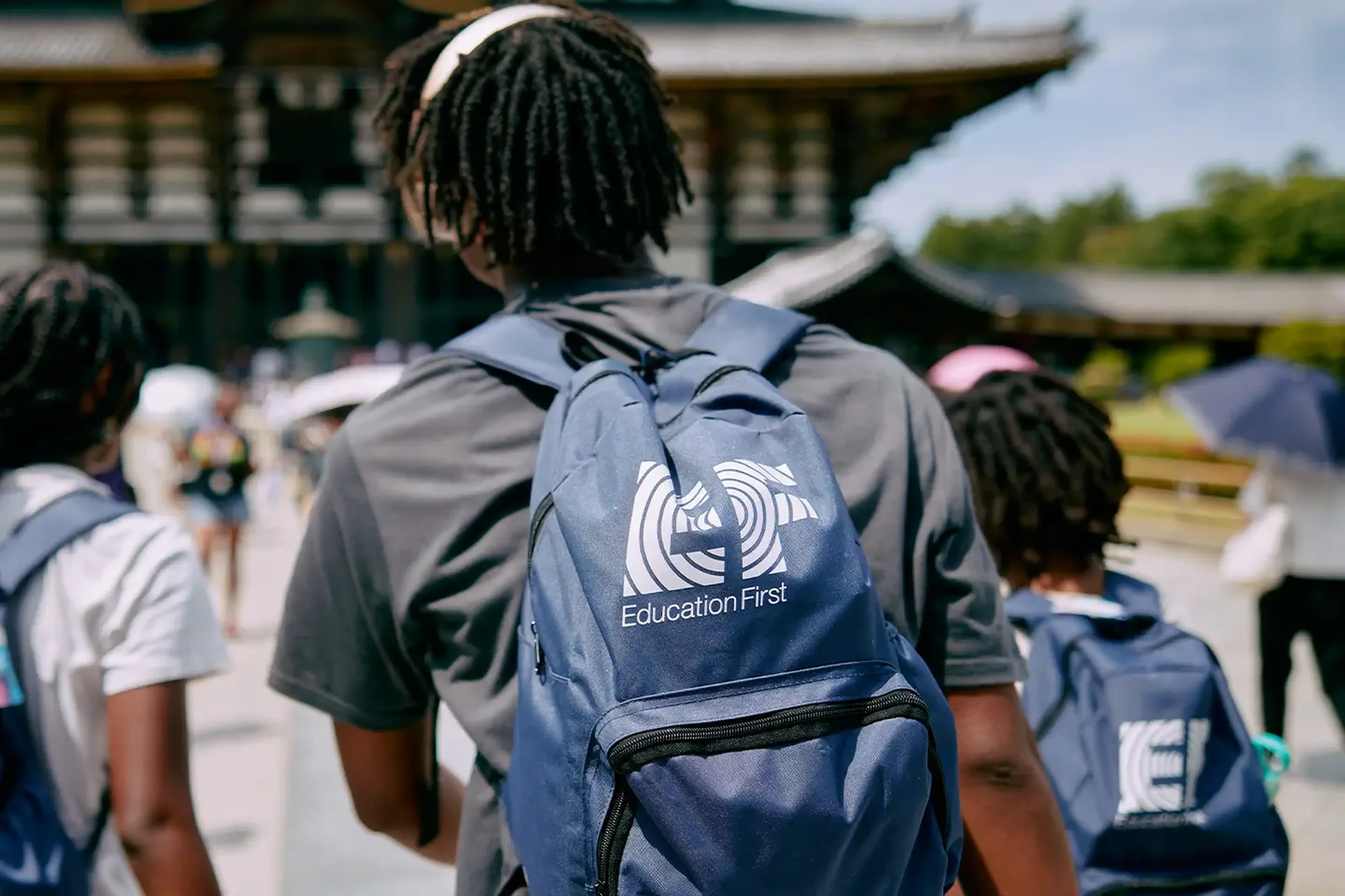 School trip packing list: student wearing EF backpack