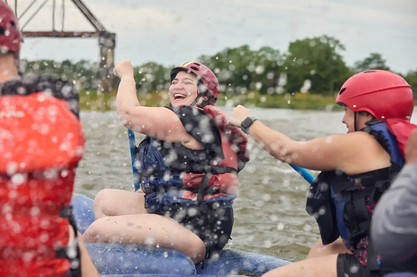 Students having fun in water raft