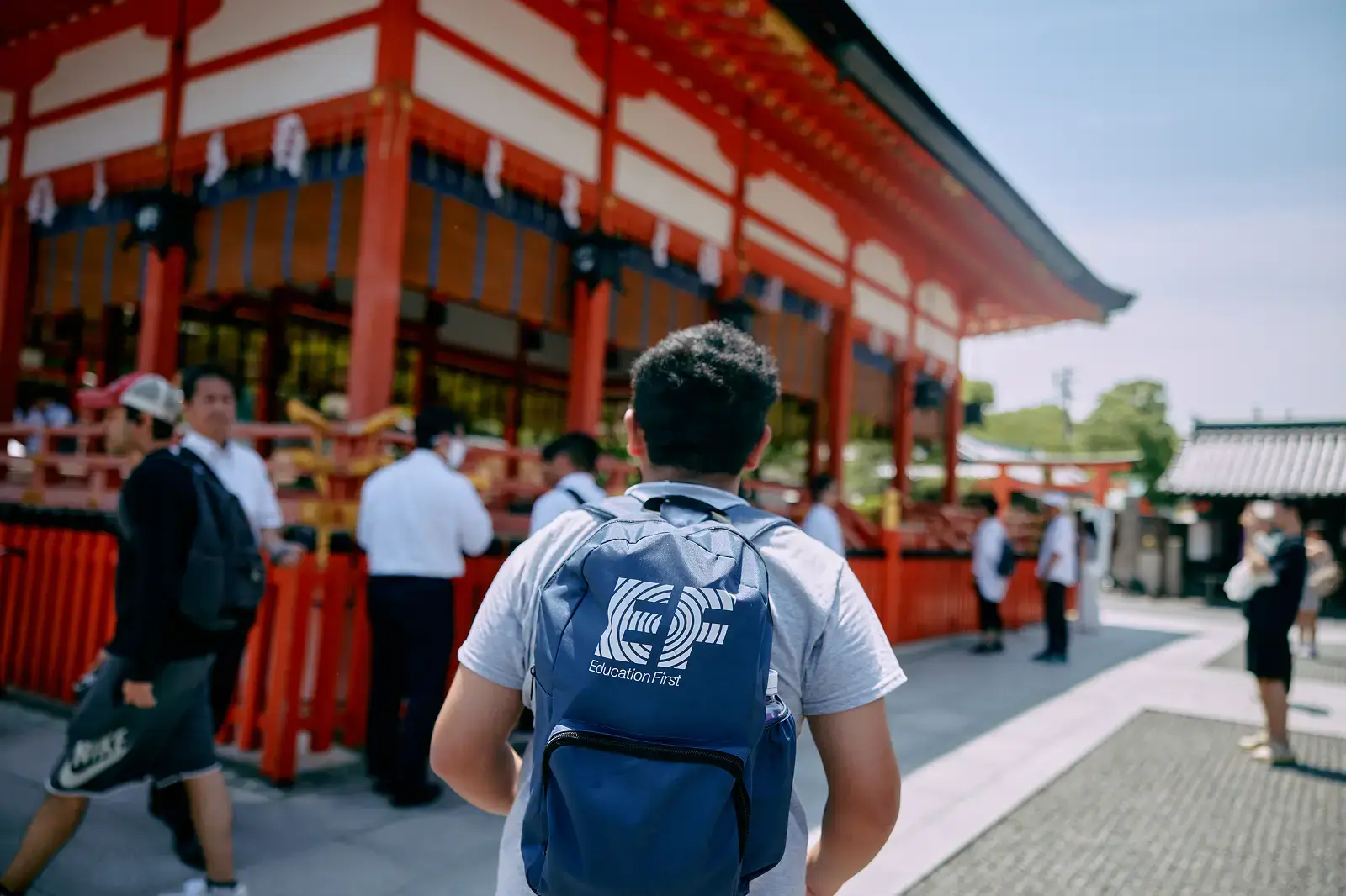 Student with EF backpack walking in Japan