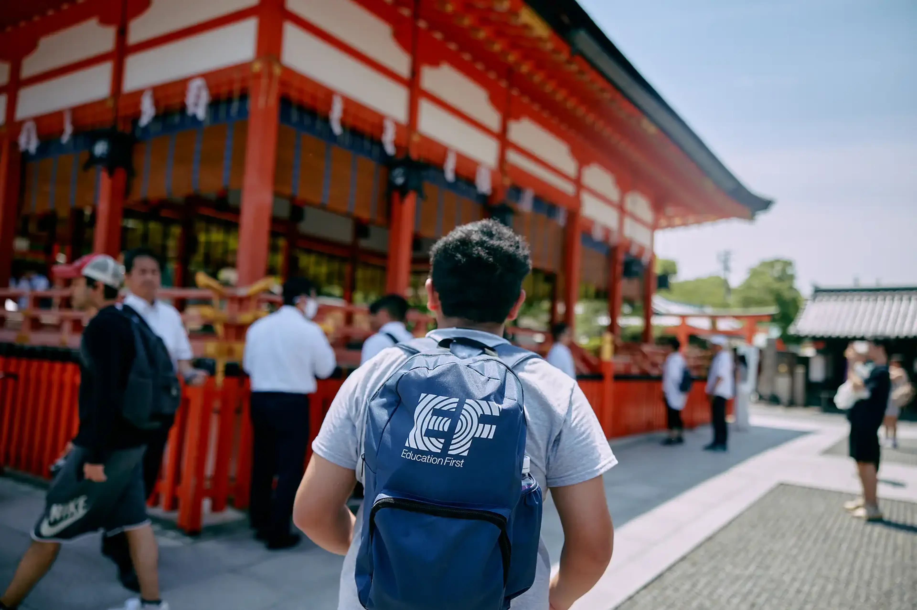 Student with EF backpack walking in Japan