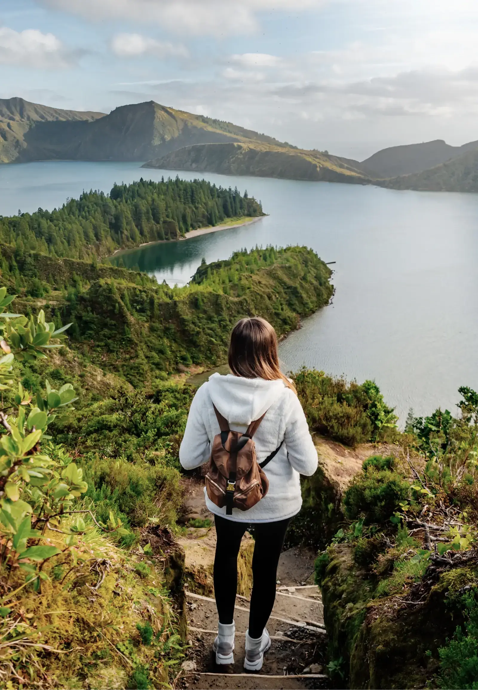 student hiking on a hill in the azores