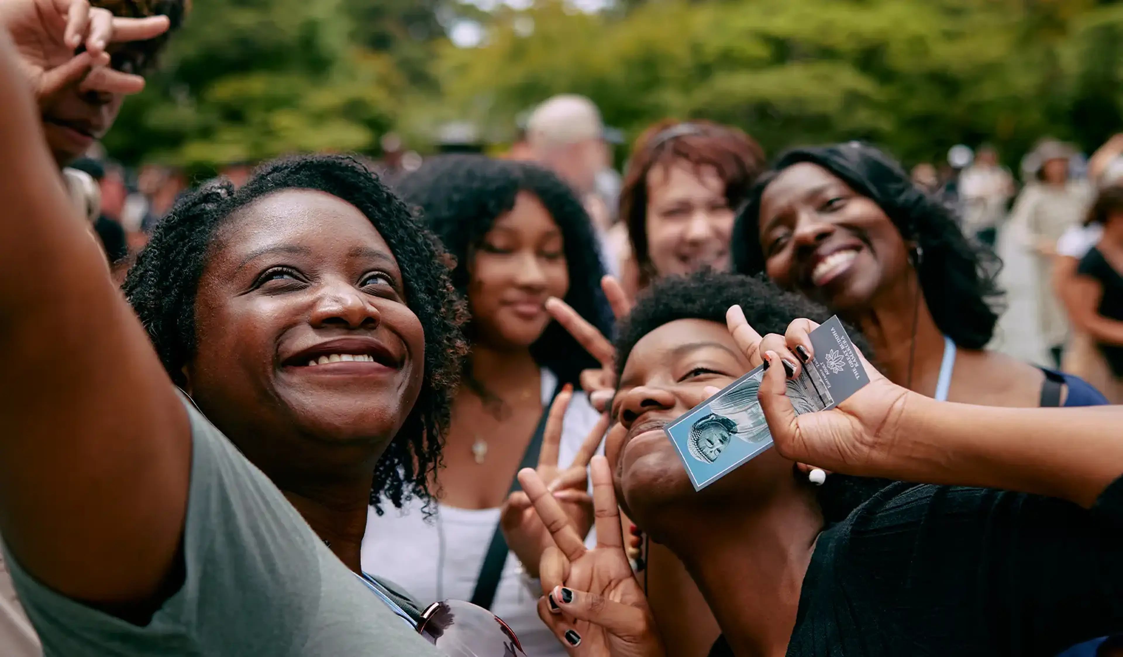 students taking a selfie with group leader on tour