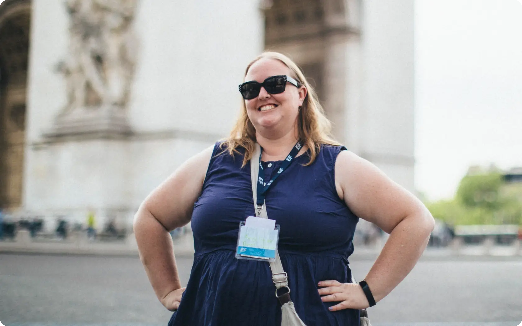 group leader standing near the etoile in paris france with the arc de triomphe