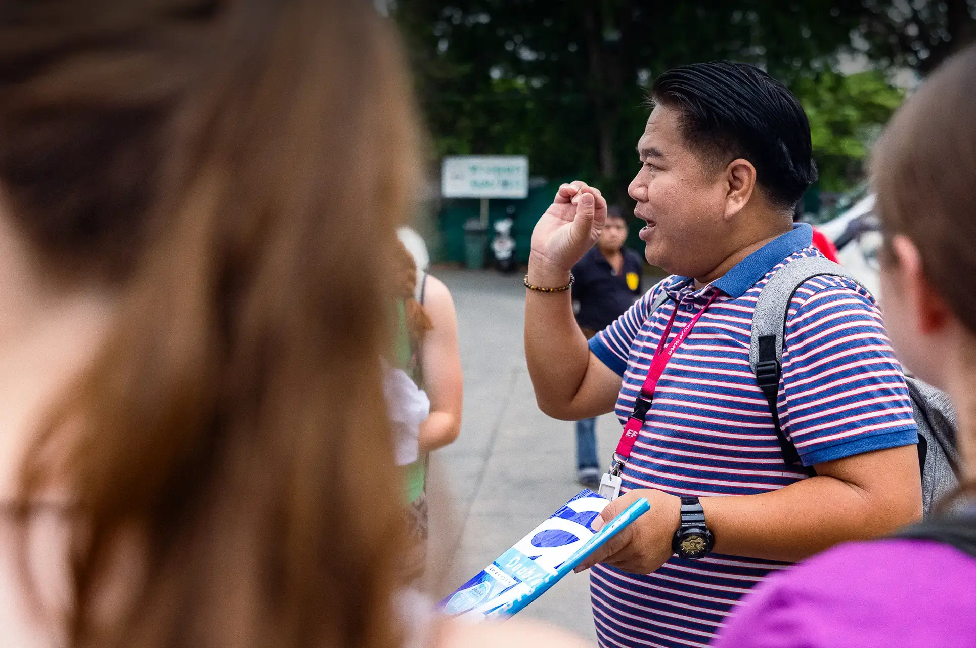Tour Director explaining giving instructions to students