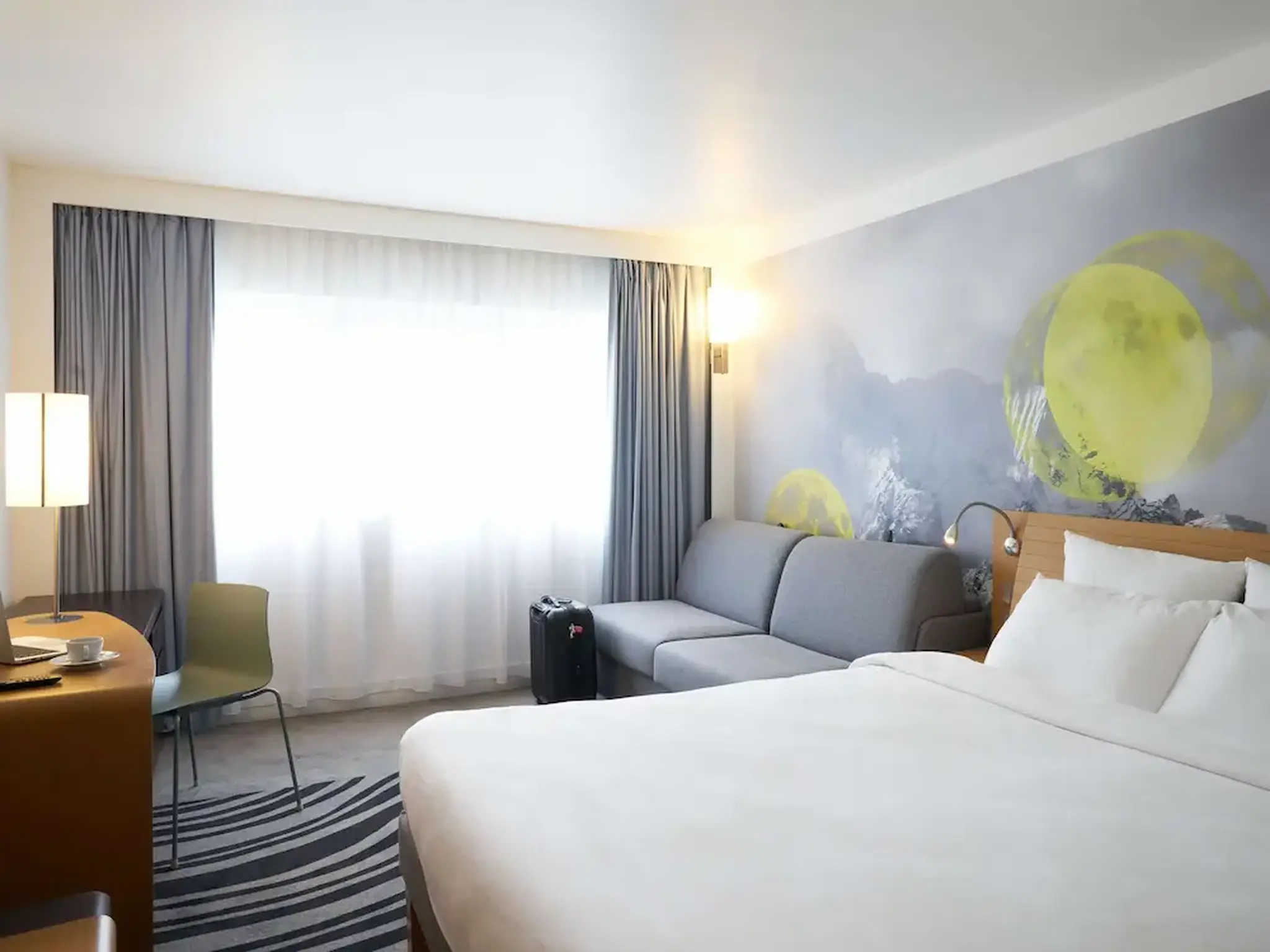 hotel room double bed and sofa