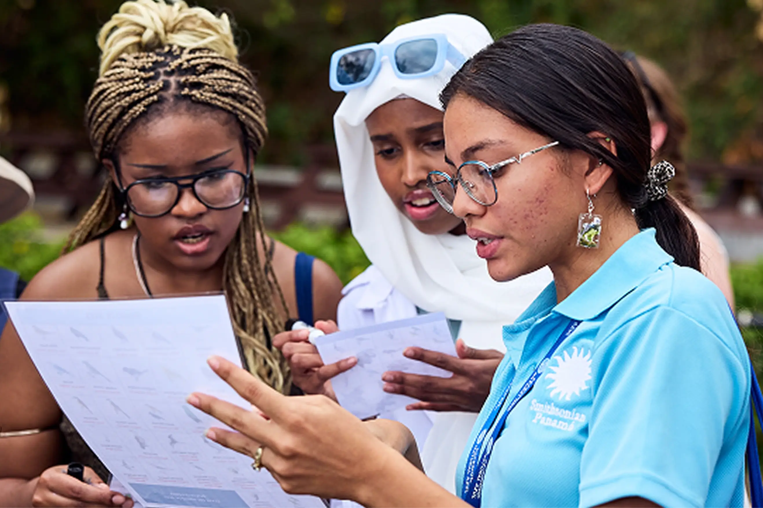 Students with a guide looking at a map