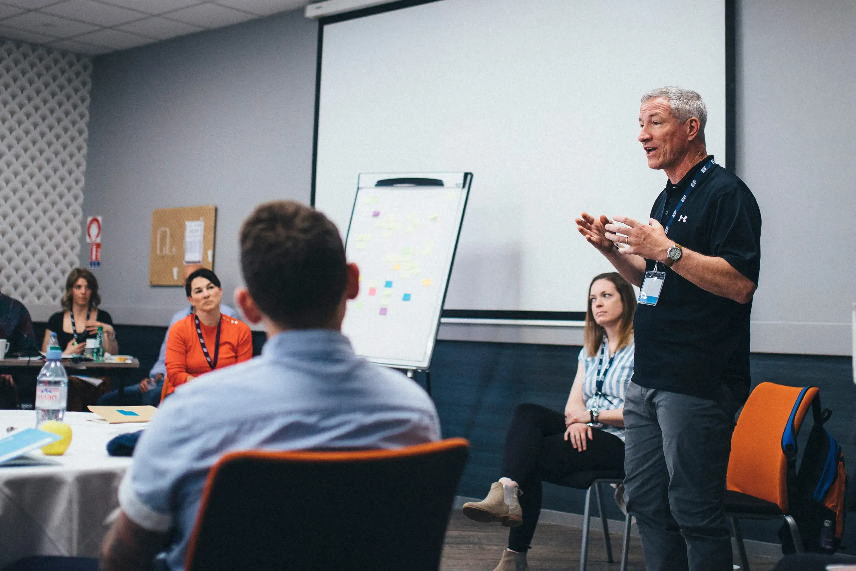 Man talking to group of teachers