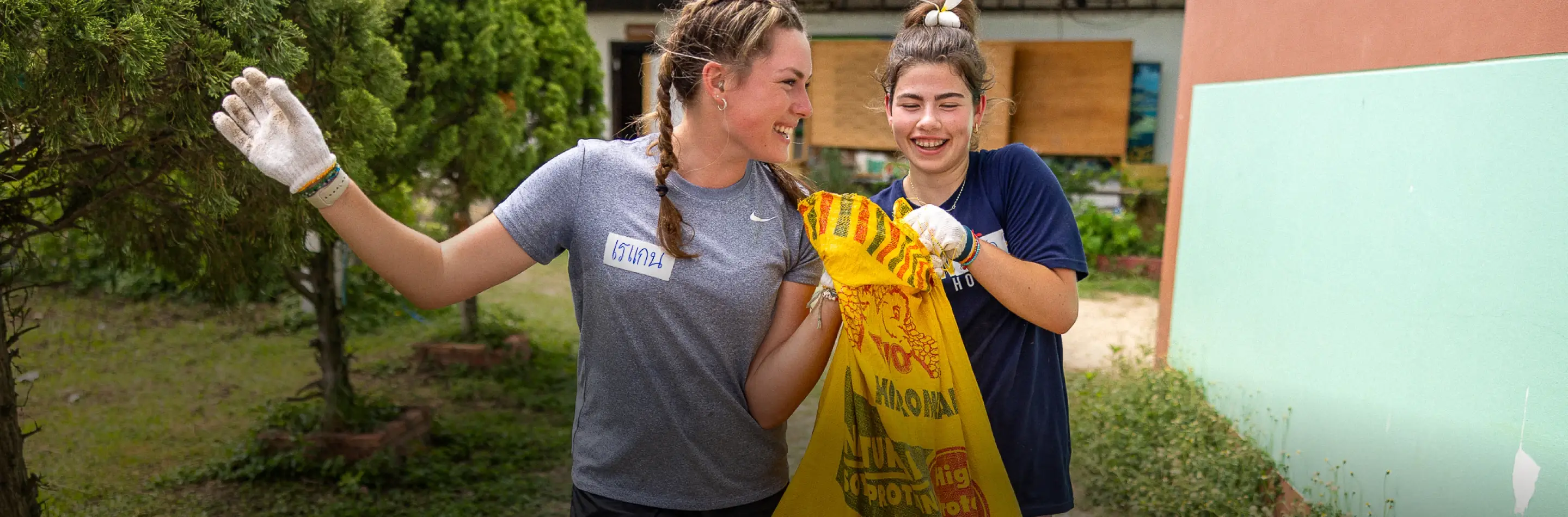 students working on a community engagement project in thailand