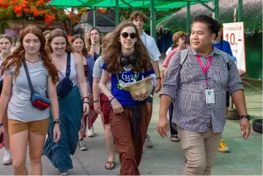 EF Tour Director walking with a group of students