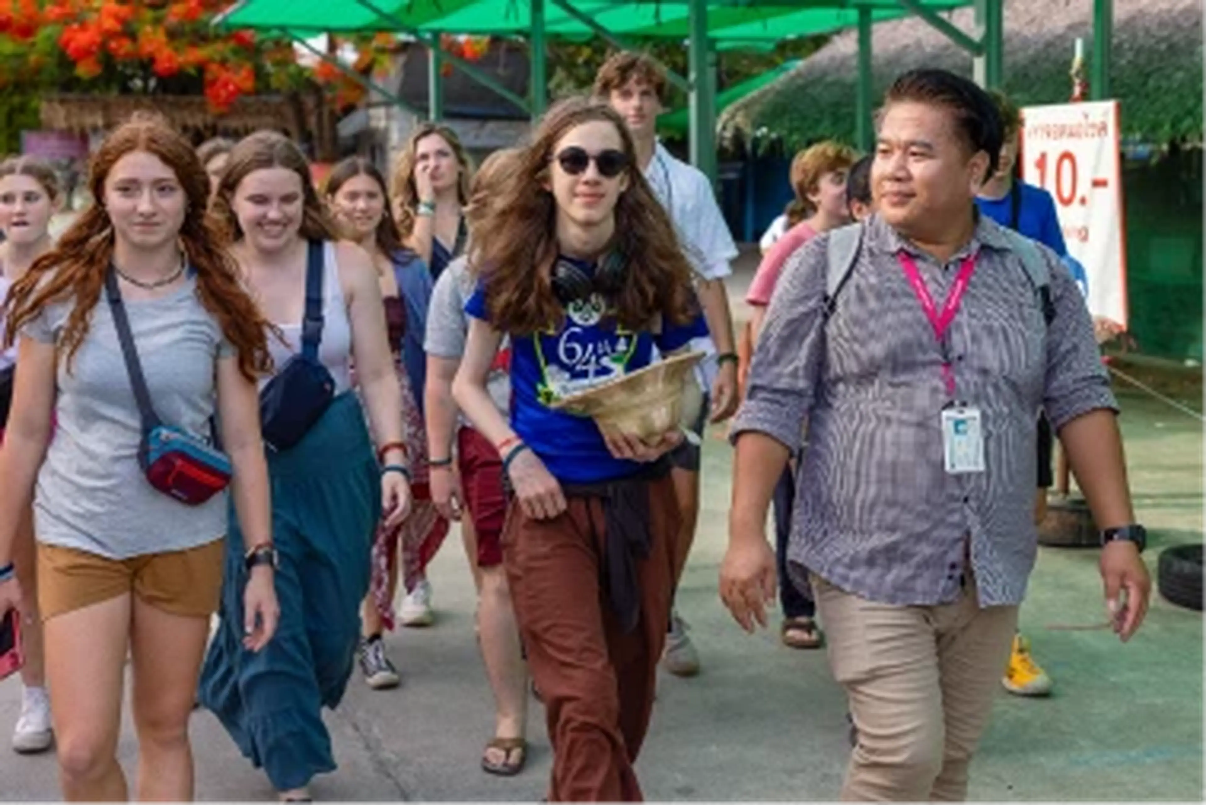 EF Tour Director walking with a group of students
