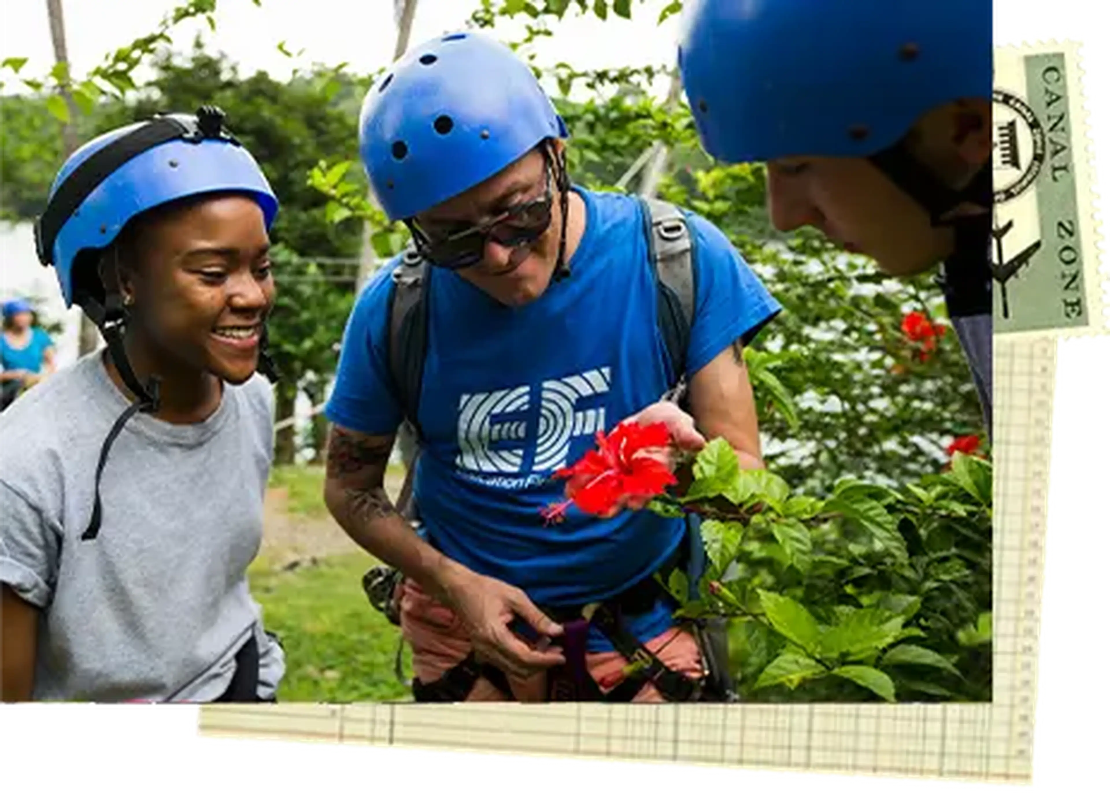 student and tour director looking at a flower