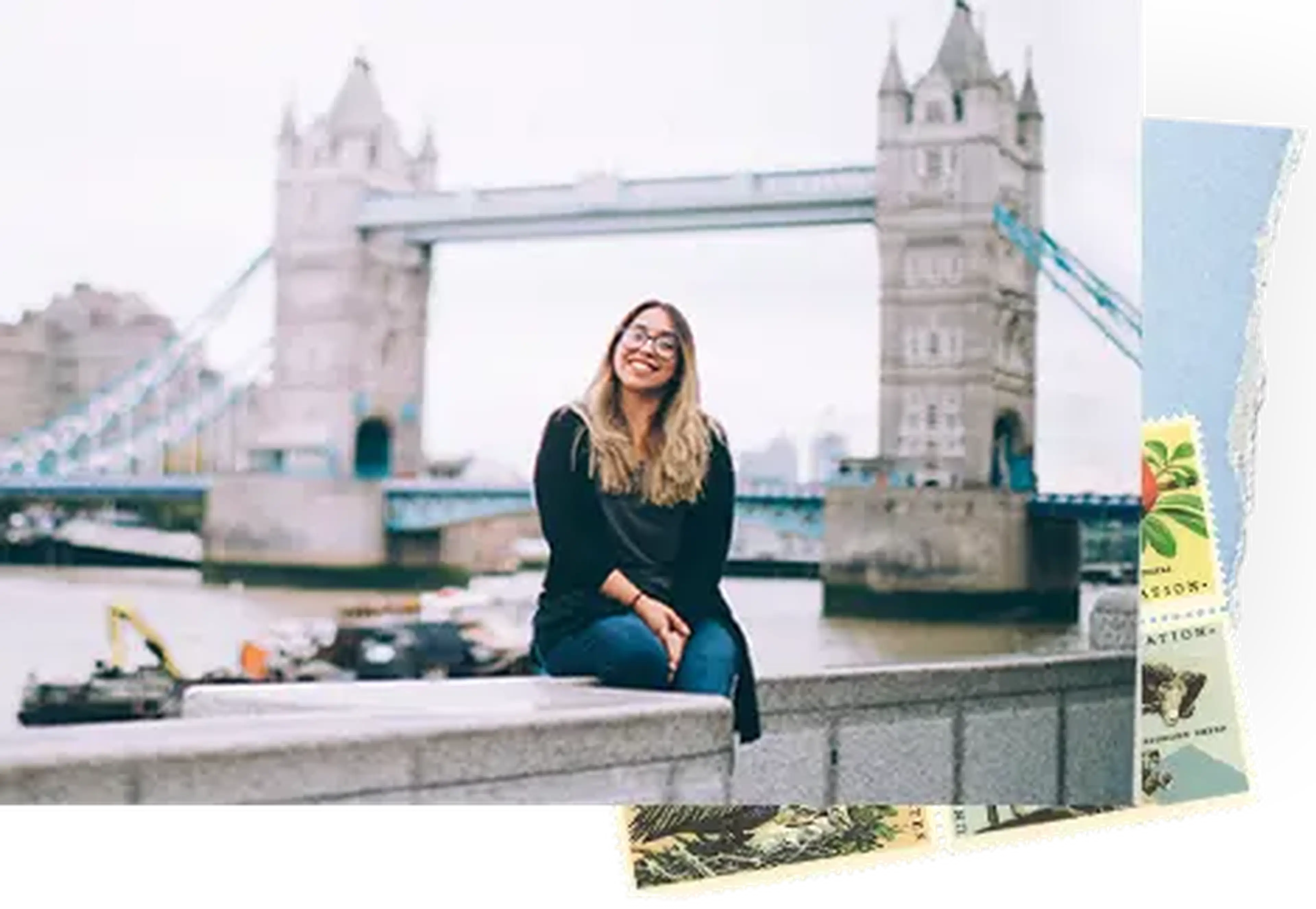 student sitting in front of london bridge