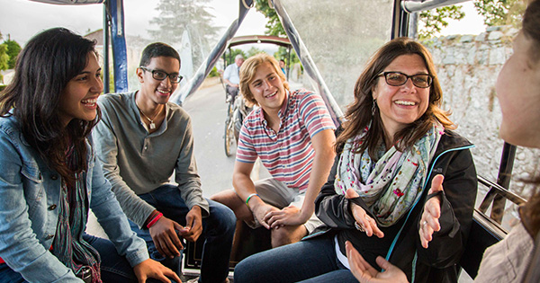 Students and teacher laughing on tour