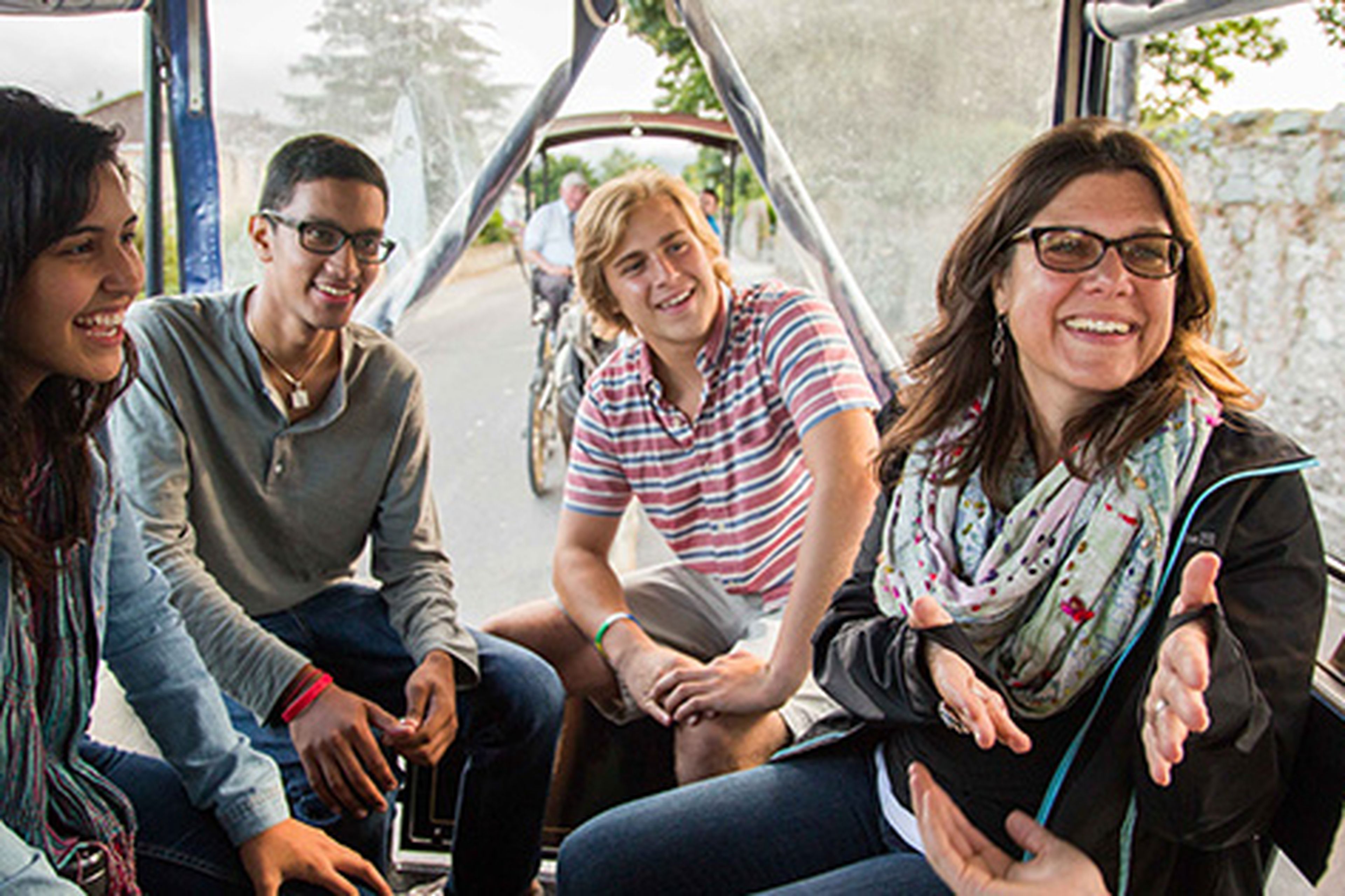 Students and teacher laughing on tour