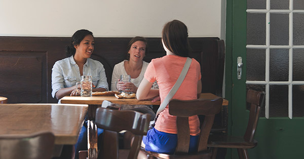 giving crowdfunding tips at a table
