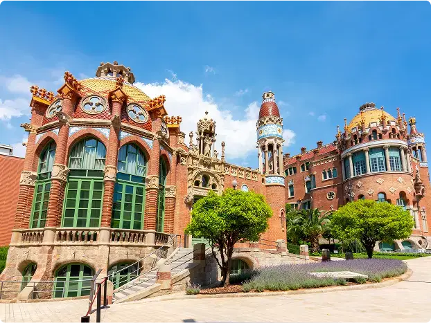 Marvel at the vibrant Art Nouveau architecture of Sant Pau, a former hospital