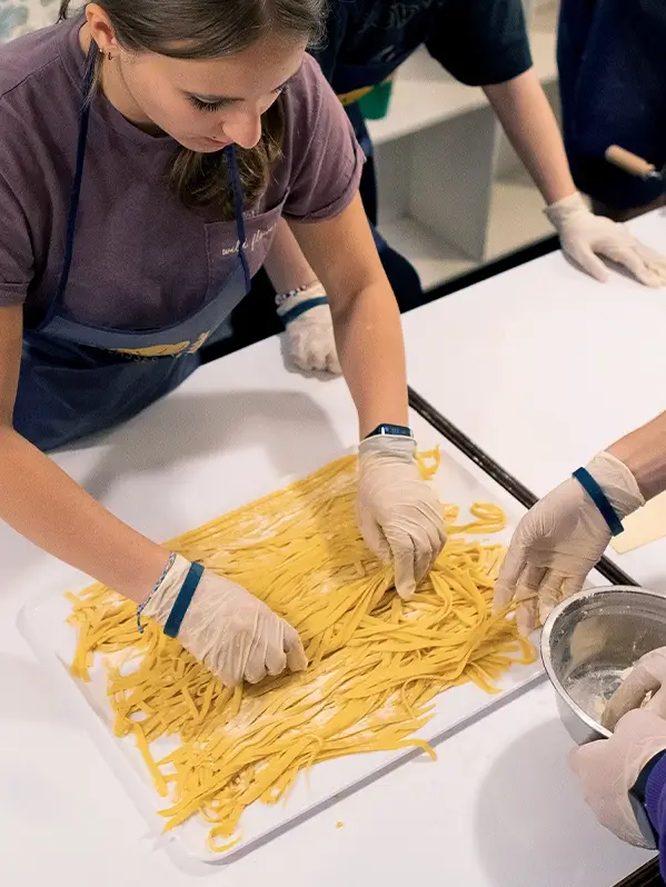 students cooking on tour