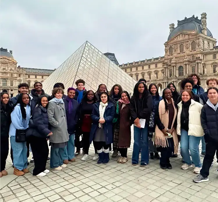 Group of travelers visiting the Louvre in Paris, France