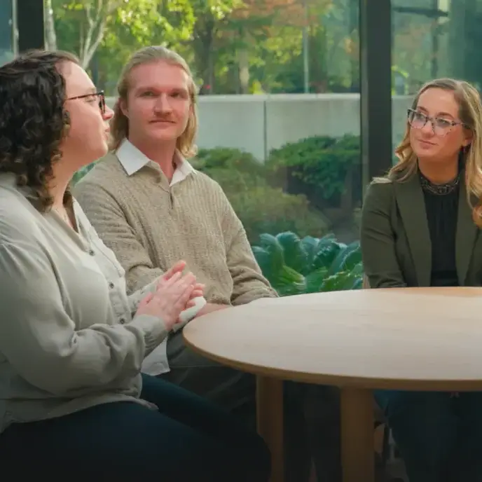 tour consultants and experience specialists talk around a table