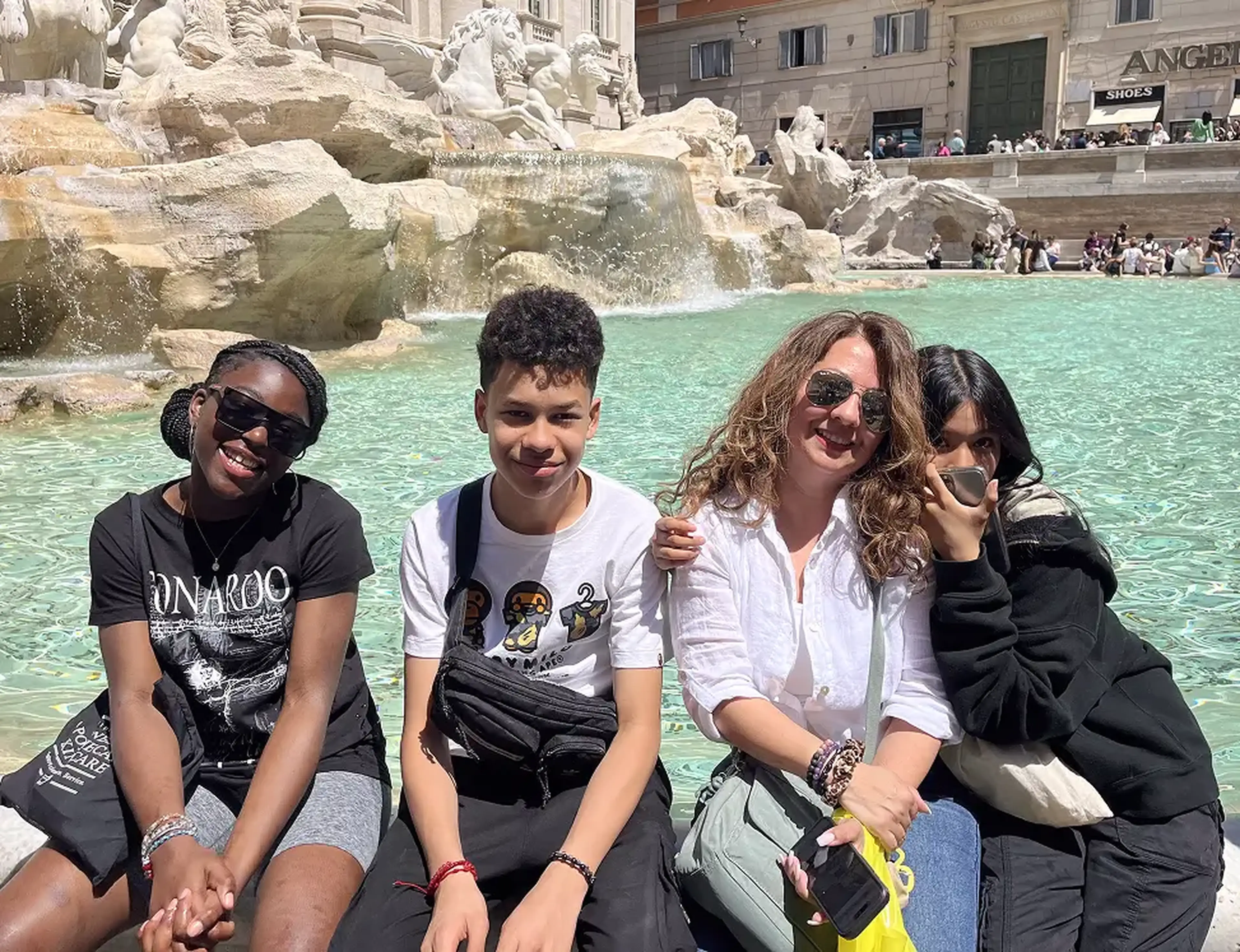 Middle school travelers at fountain in Italy