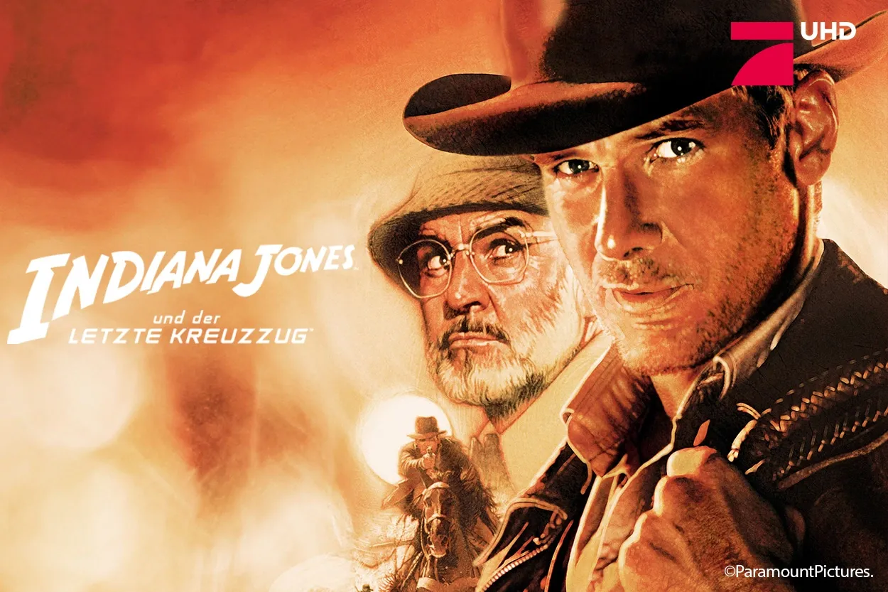 Stilisiertes Filmplakat, auf dem zwei Männer zu sehen sind – einer davon mit Fedora und Lederjacke –, mit detailreicher Gestaltung. Der Text lautet: „Indiana Jones und der letzte Kreuzzug.“